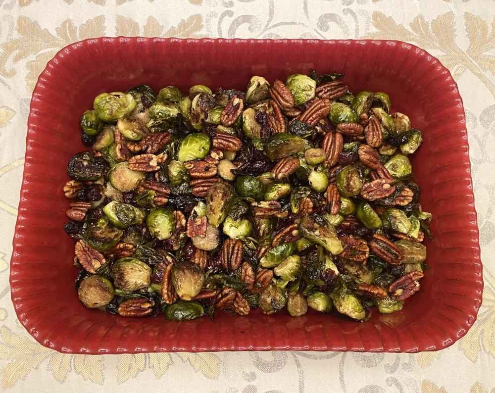 Holiday Classic - Brussels Sprouts, Cranberries and Pecans tossed in Nal's Kitchen Honey Ginger Dressing and oven roasted.