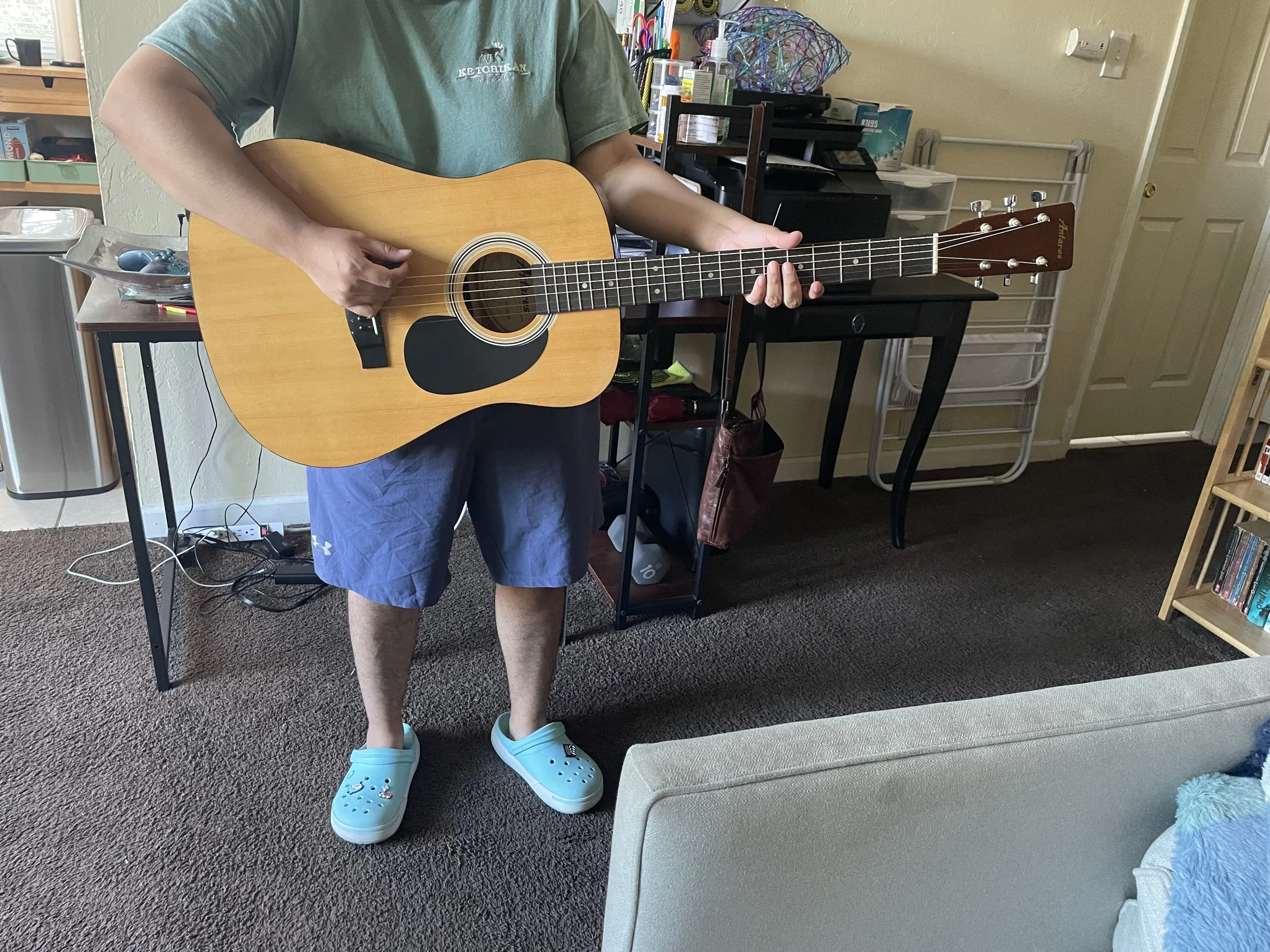Summer 2024 client with guitar.jpg