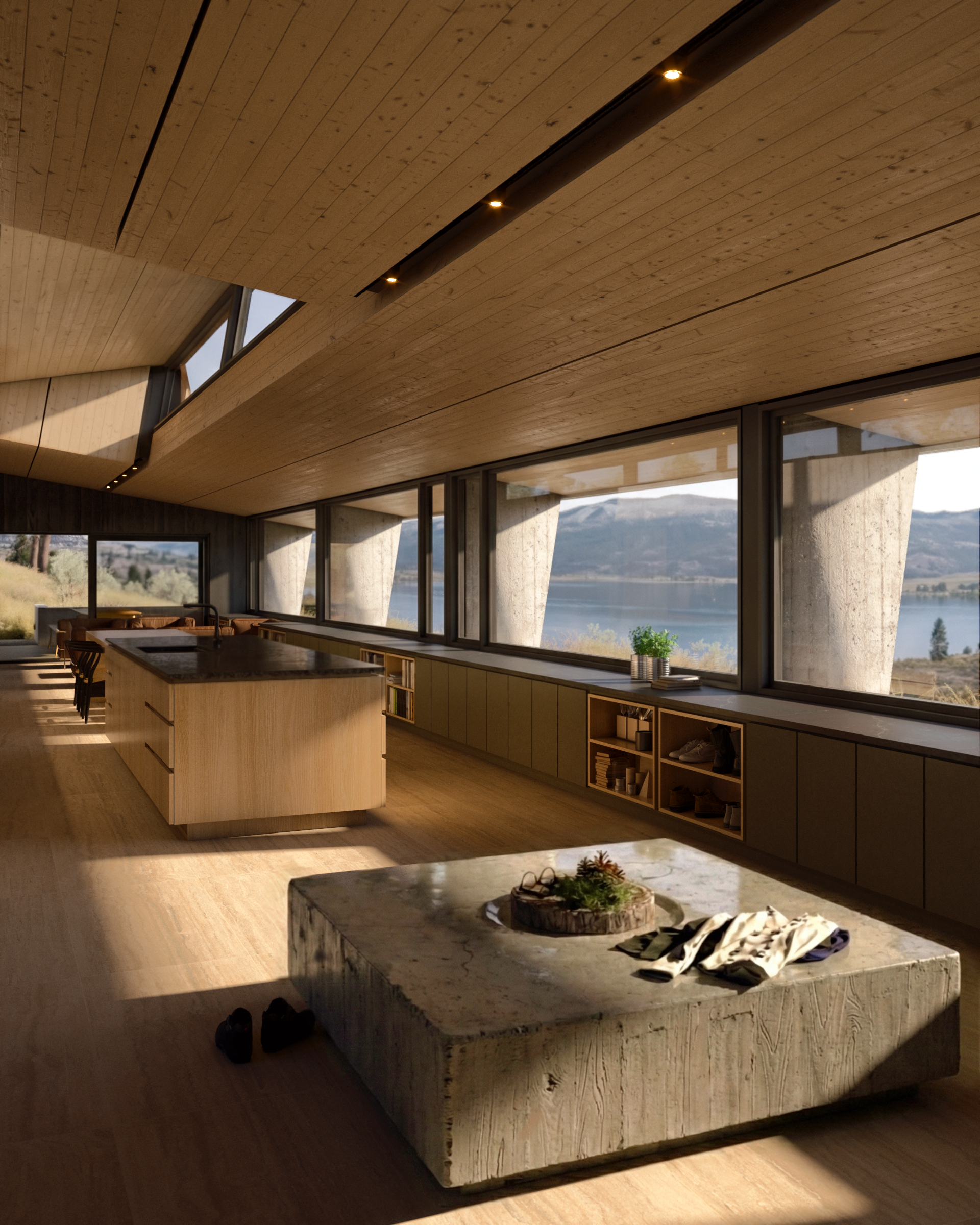 Living room with a wood-lined ceiling and stone fireplace, looking through broad glazing toward the lake and mountains.
