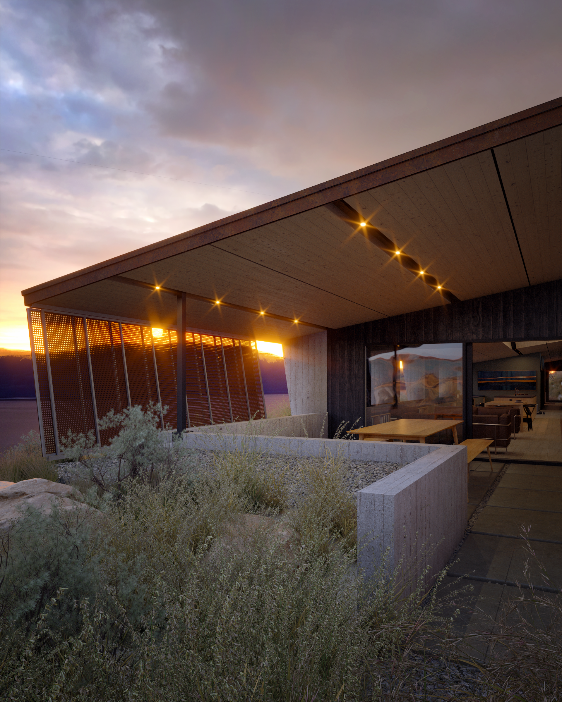 House at dusk with roof-mounted solar panels, deep overhangs and low planting around the terrace.