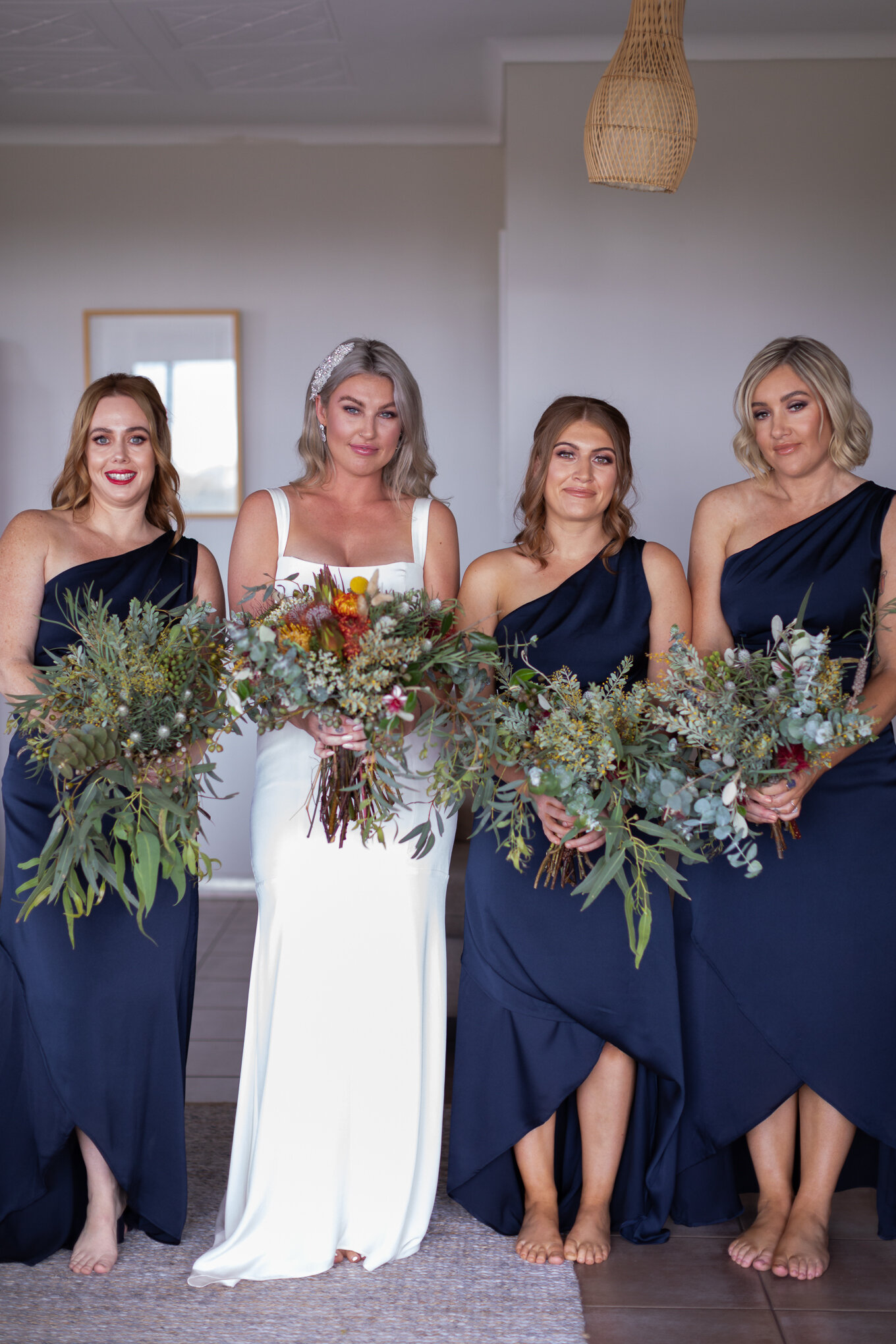 Skyla & Kym bride and bridesmaids with dresses and flowers.jpg