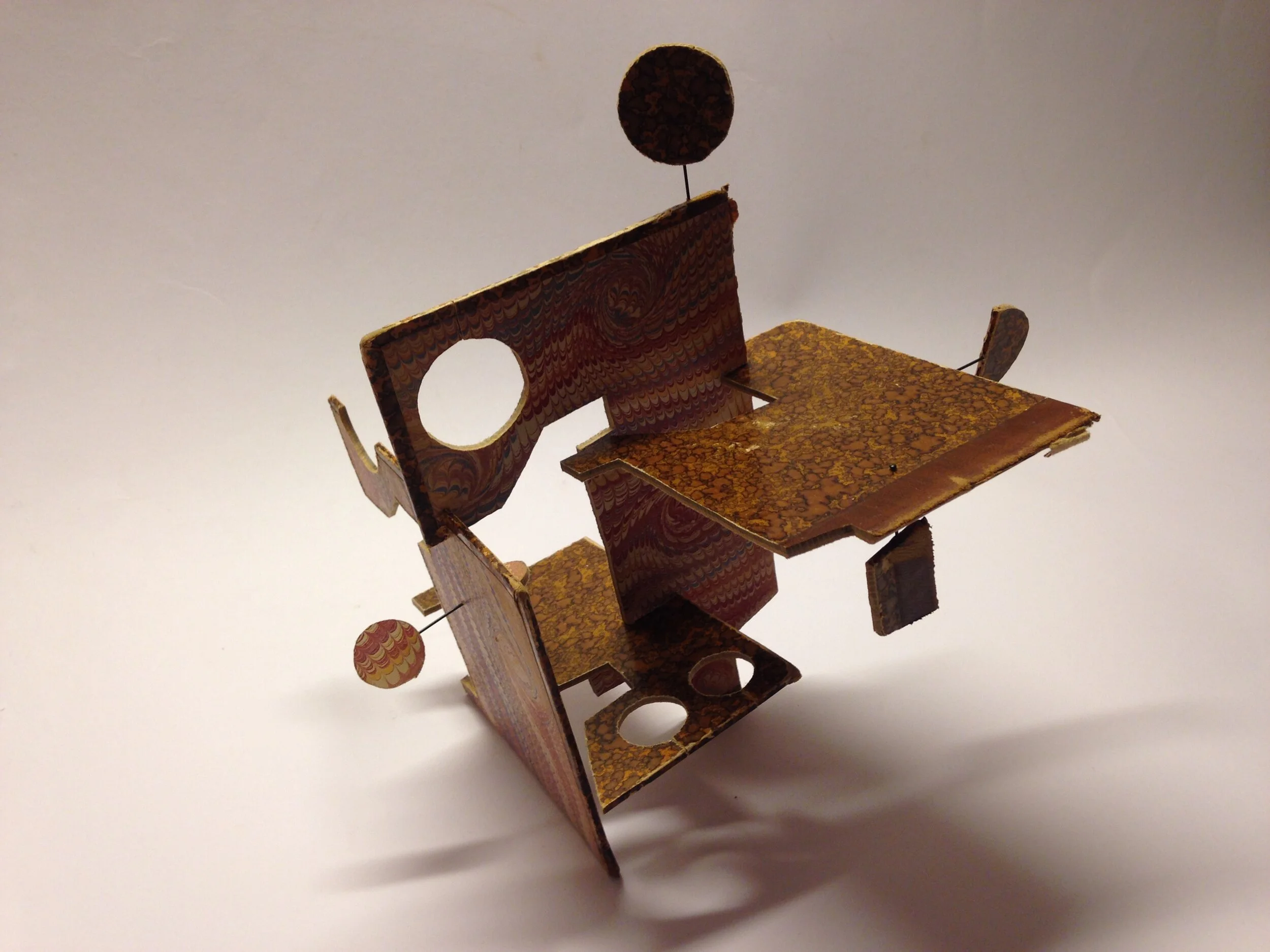 Self portrait Trilogy 'Nr 1' - small object- materials: old book cover slided into each other, steel pins. Both the front and the back of the cover were used completely - sold 