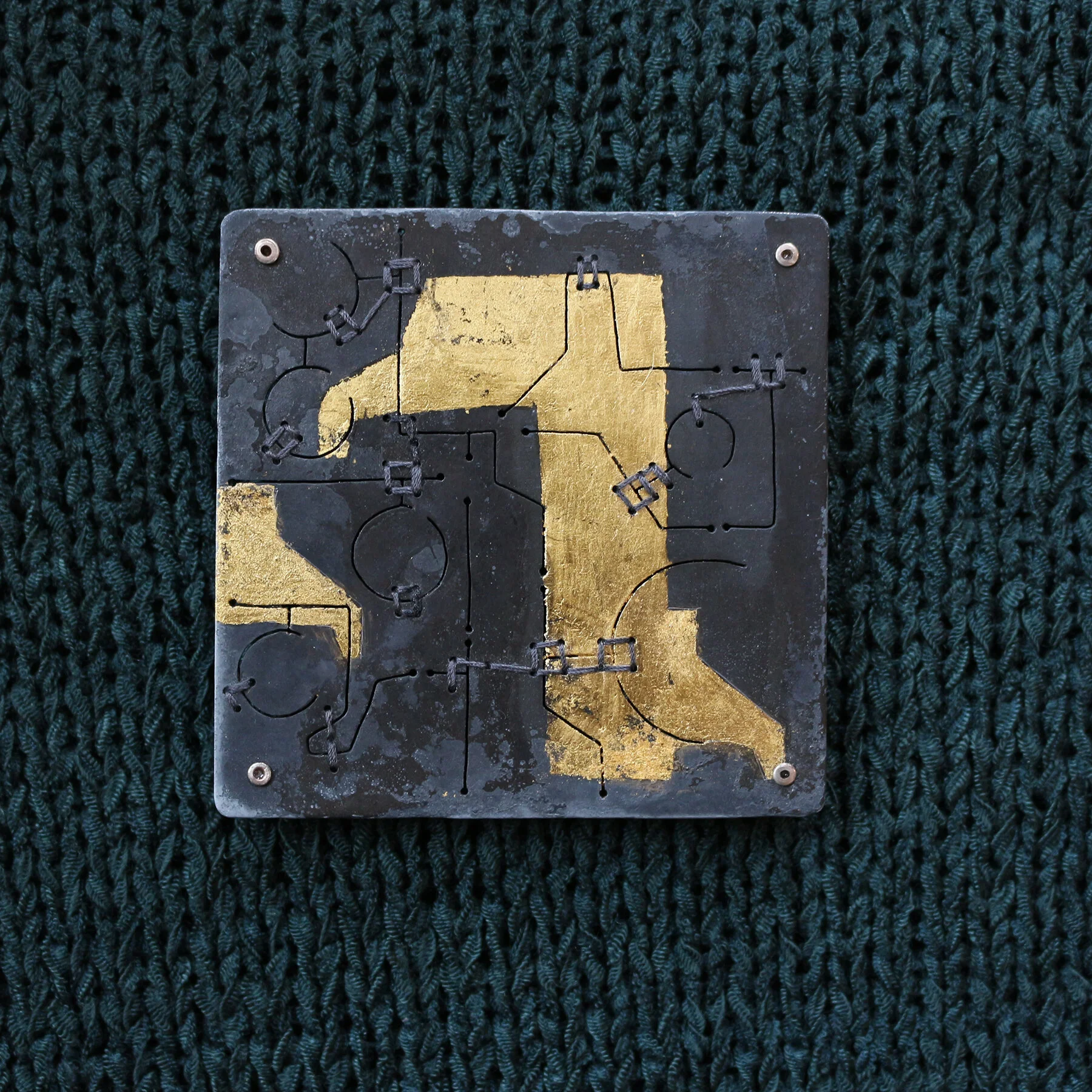 Brooch - Materials: zinc, gold leaf, silk, silver, aluminium.