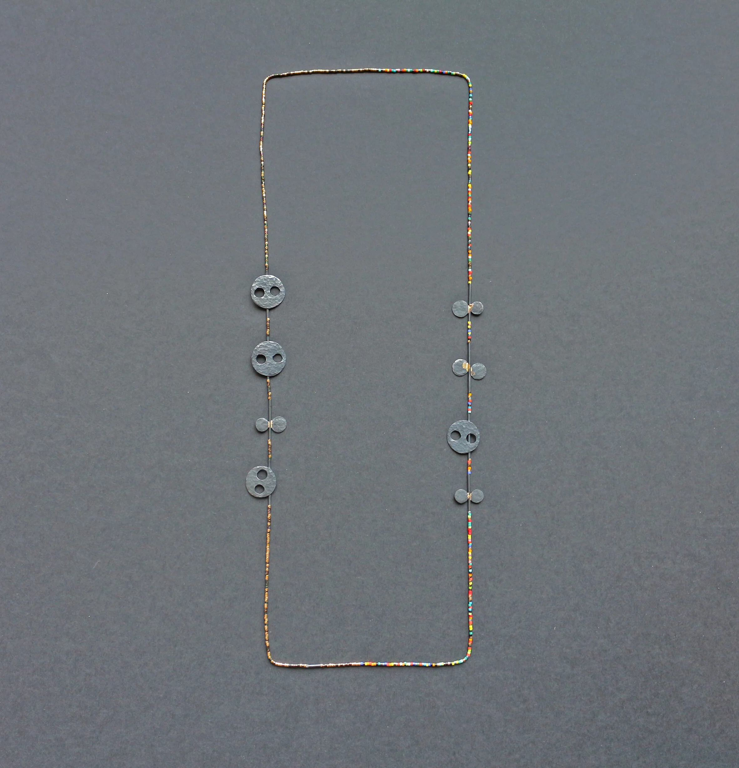 Carnival - Materials: silver, gold, Japanese glass beads, nylon thread.