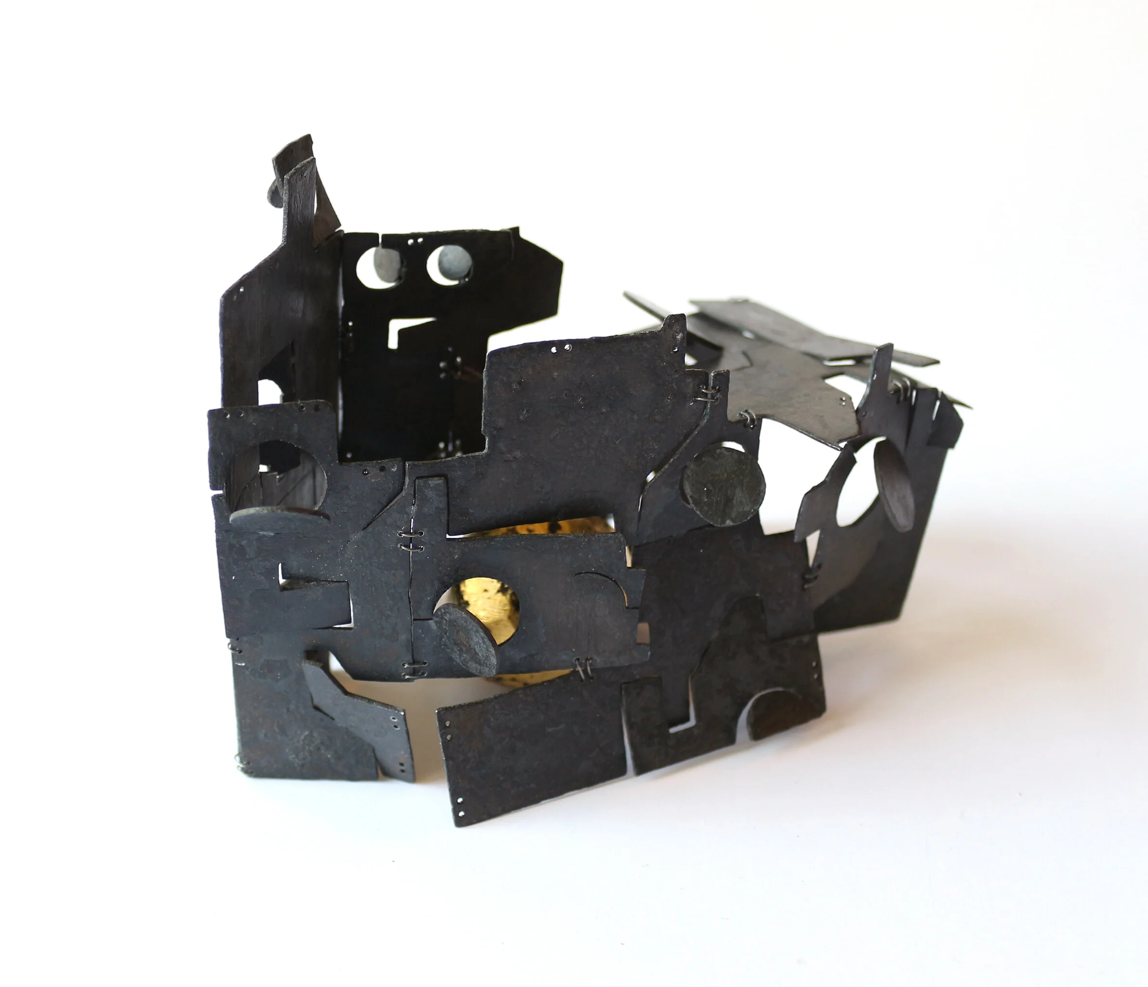 Self portrait - Ship - Object - Materials: zinc, wire, gold leaf, African black wood. Size: about two fists next to each other. 
