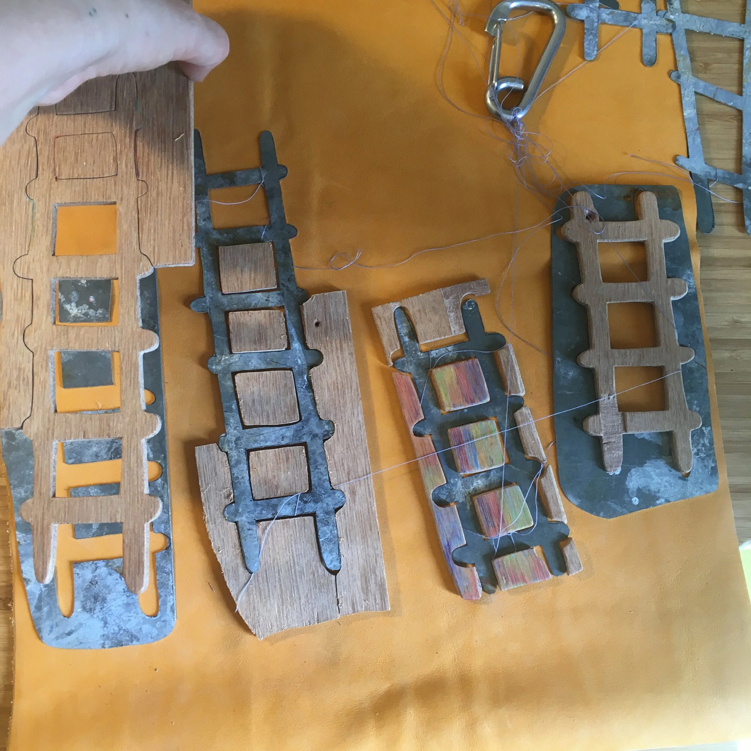 Leathers made of wood, zinc and brass
