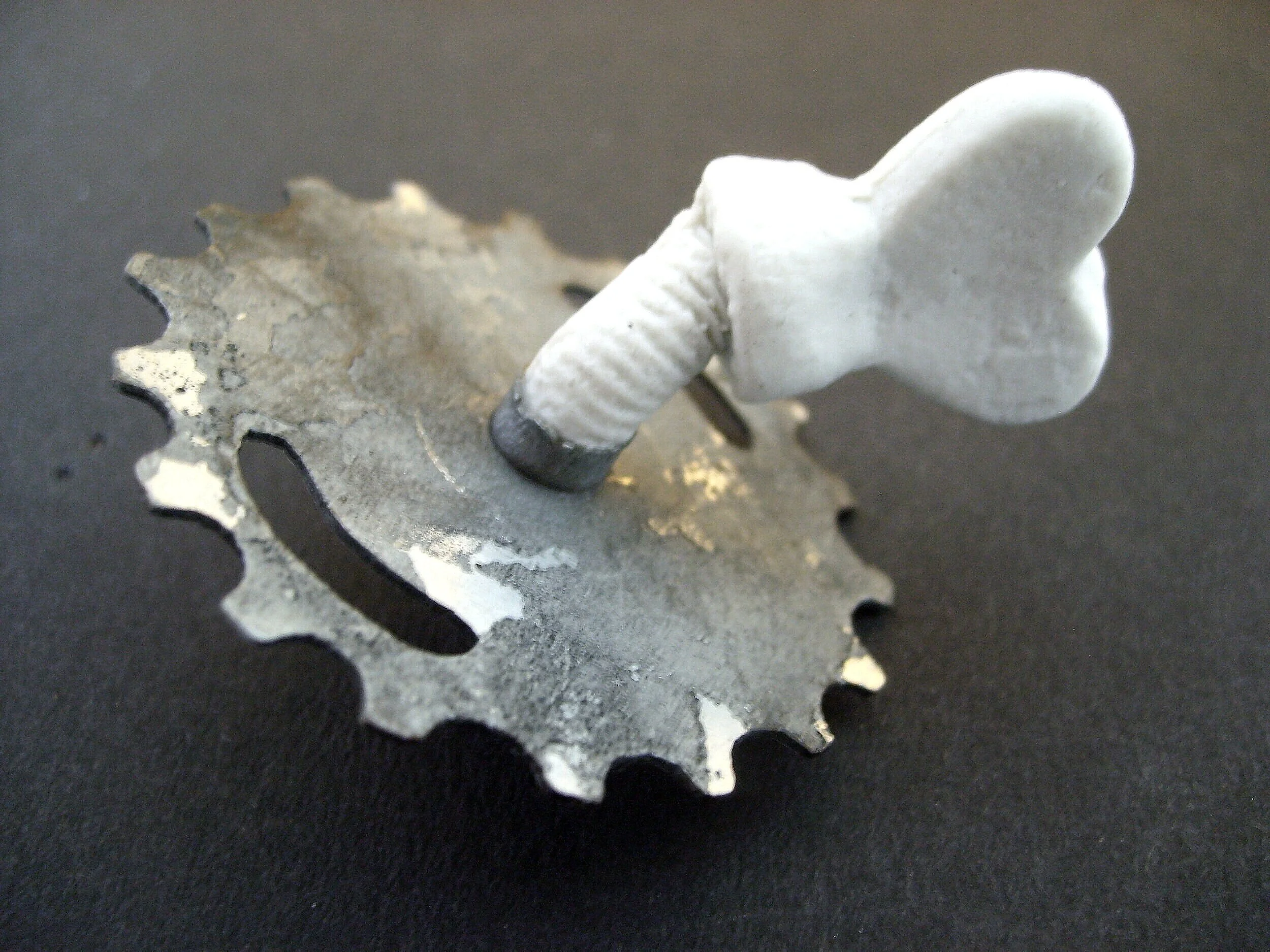 Turn Me On 'Nr 5' - Materials:  etched zinc, porcelain object, push pin