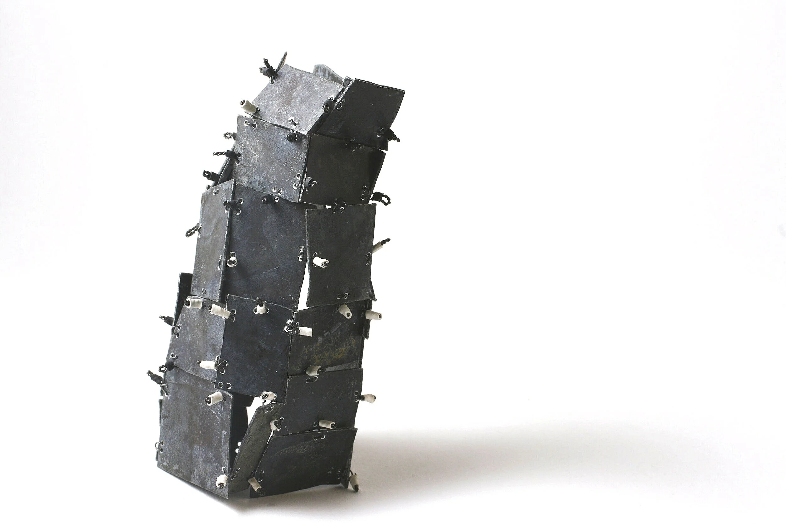 Folding Flat - Kinetic Object - Materials: etching plates of other artists, iron wire, shrinking plastic