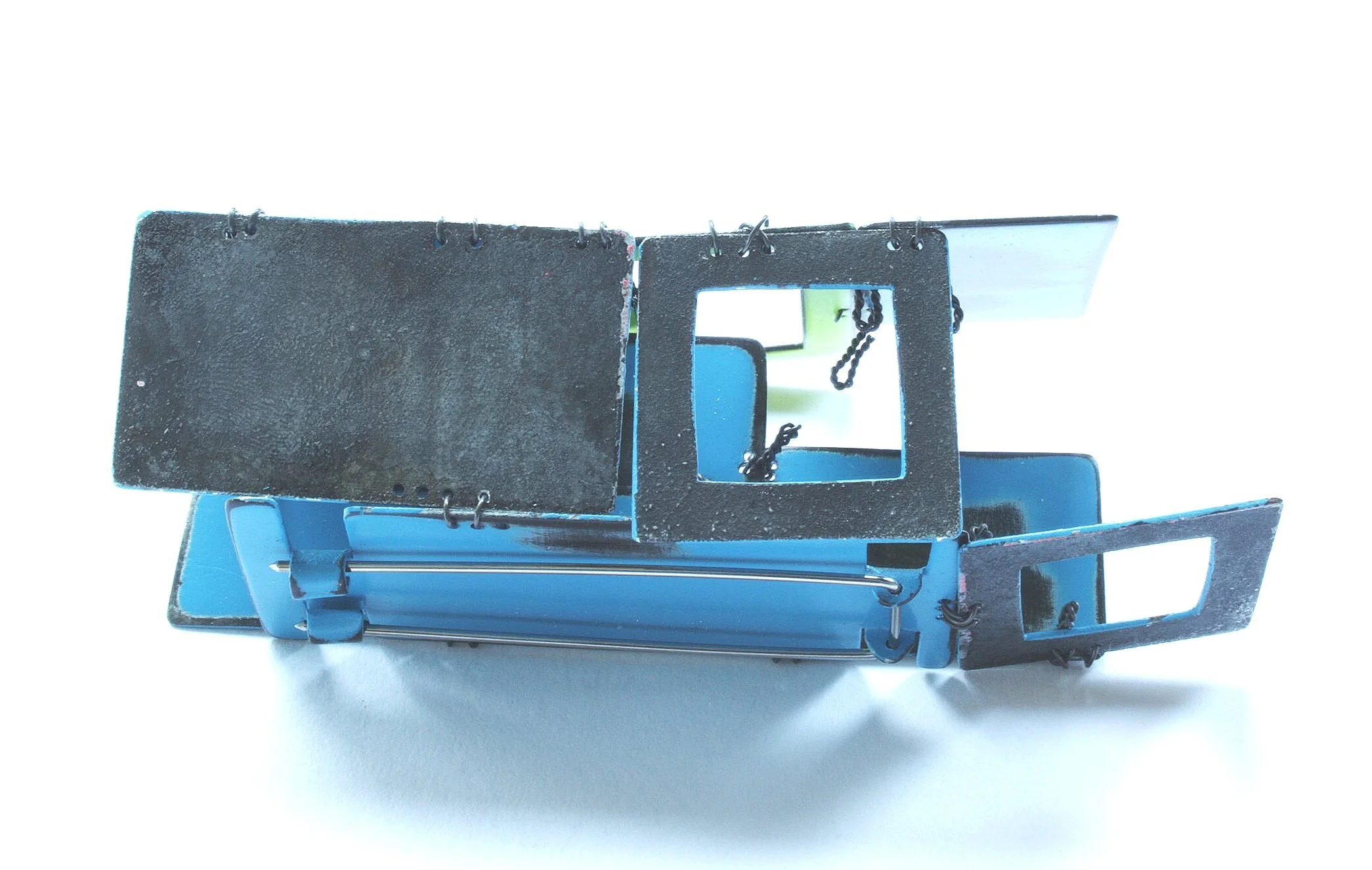 There is life after graduation - Kinetic Brooch - Materials: zinc, paint, iron wire