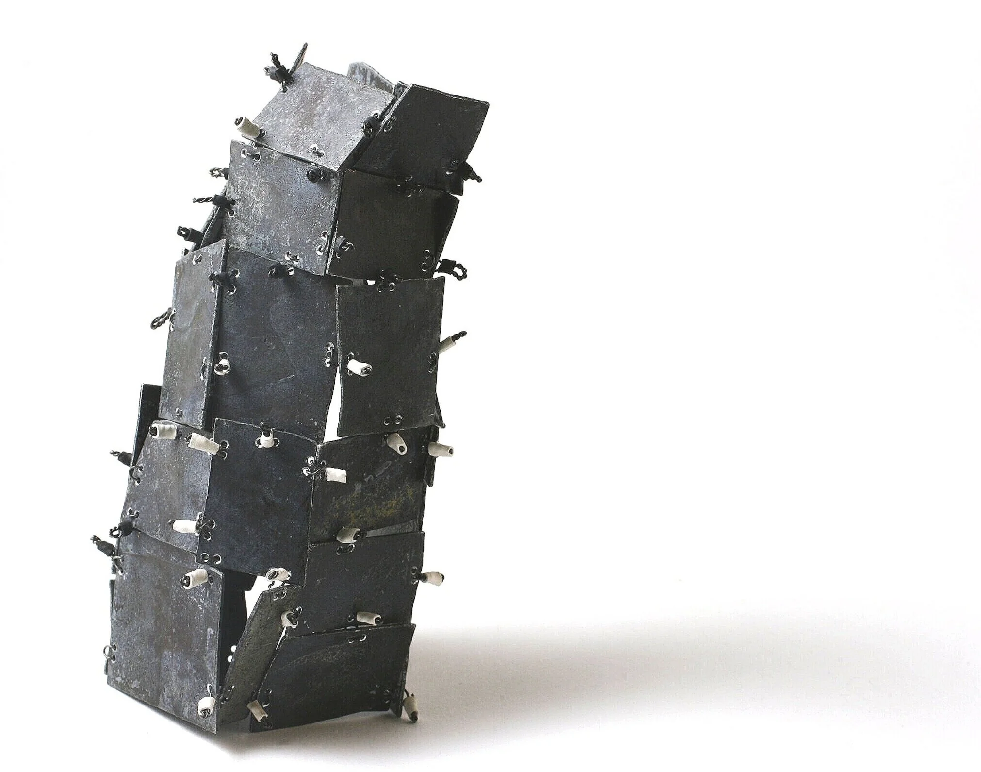 Folding Flat - Kinetic Object - Materials: etching plates of other artists, iron wire, shrinking plastic