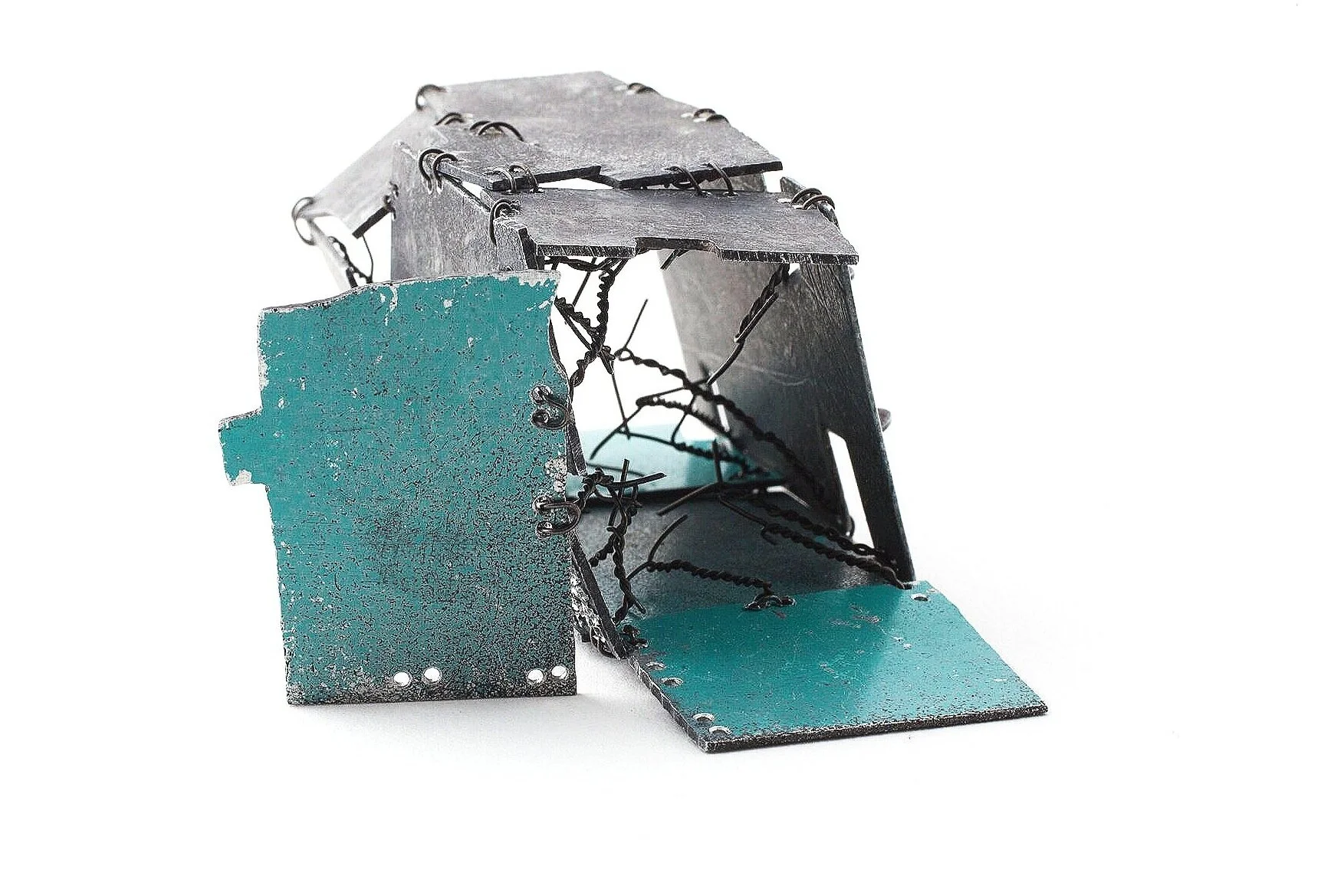 Shelter I. - Kinetic Brooch - Materials: etching plates of other artists, iron wire, paint - private collection