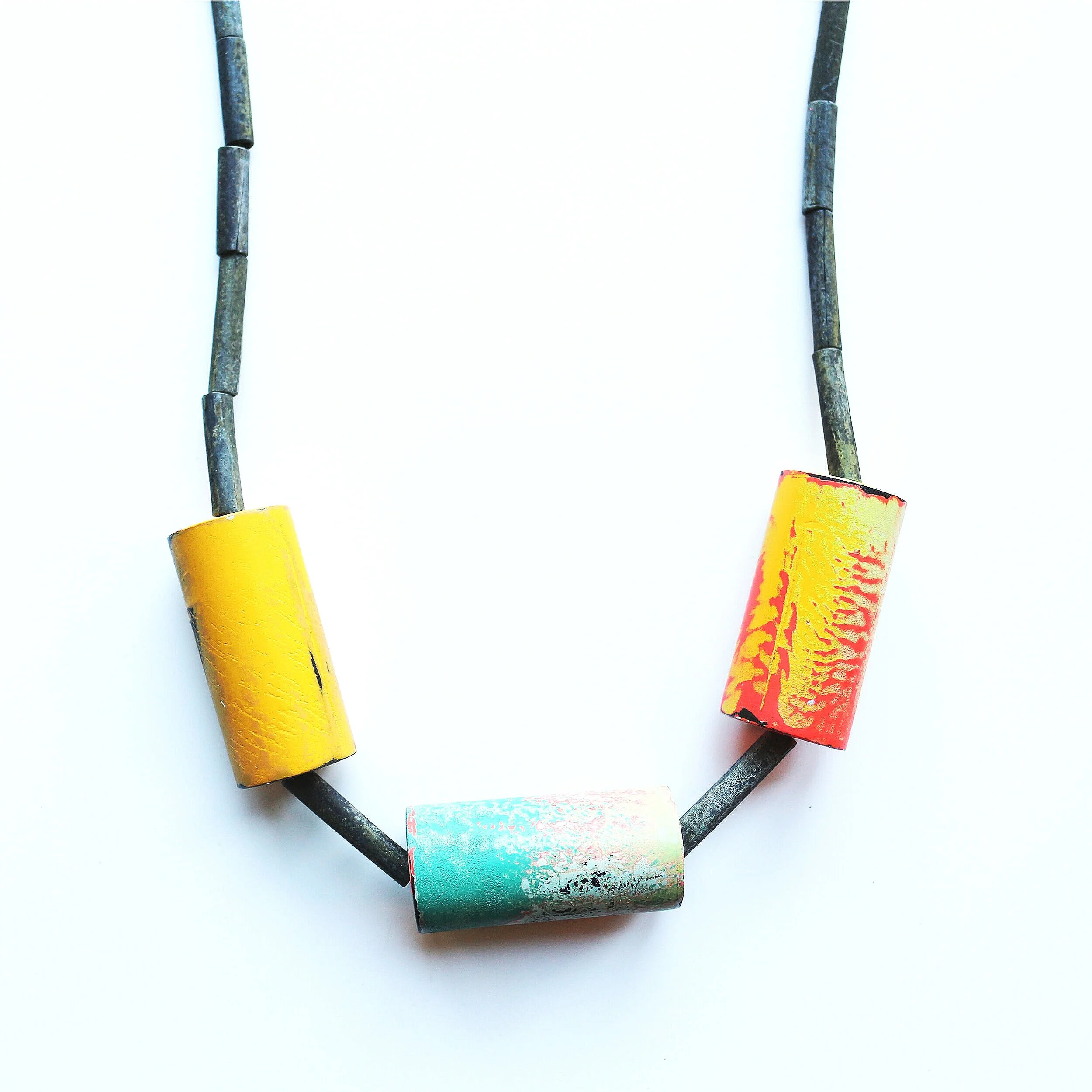 Rainbow rolls /detail/ - Materials: zinc, paint, leather rope