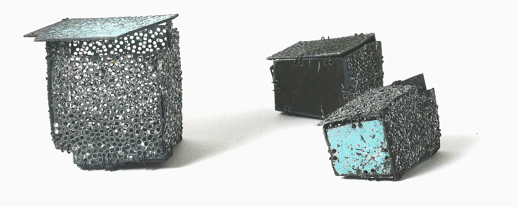 Settlement - Two objects and a brooch - Materials: etching plates of other artists, paint, iron wire