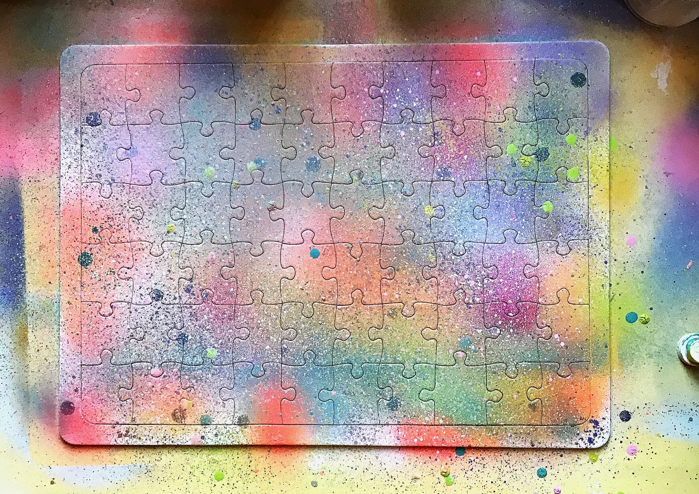 spray paint on blanco paper puzzle
