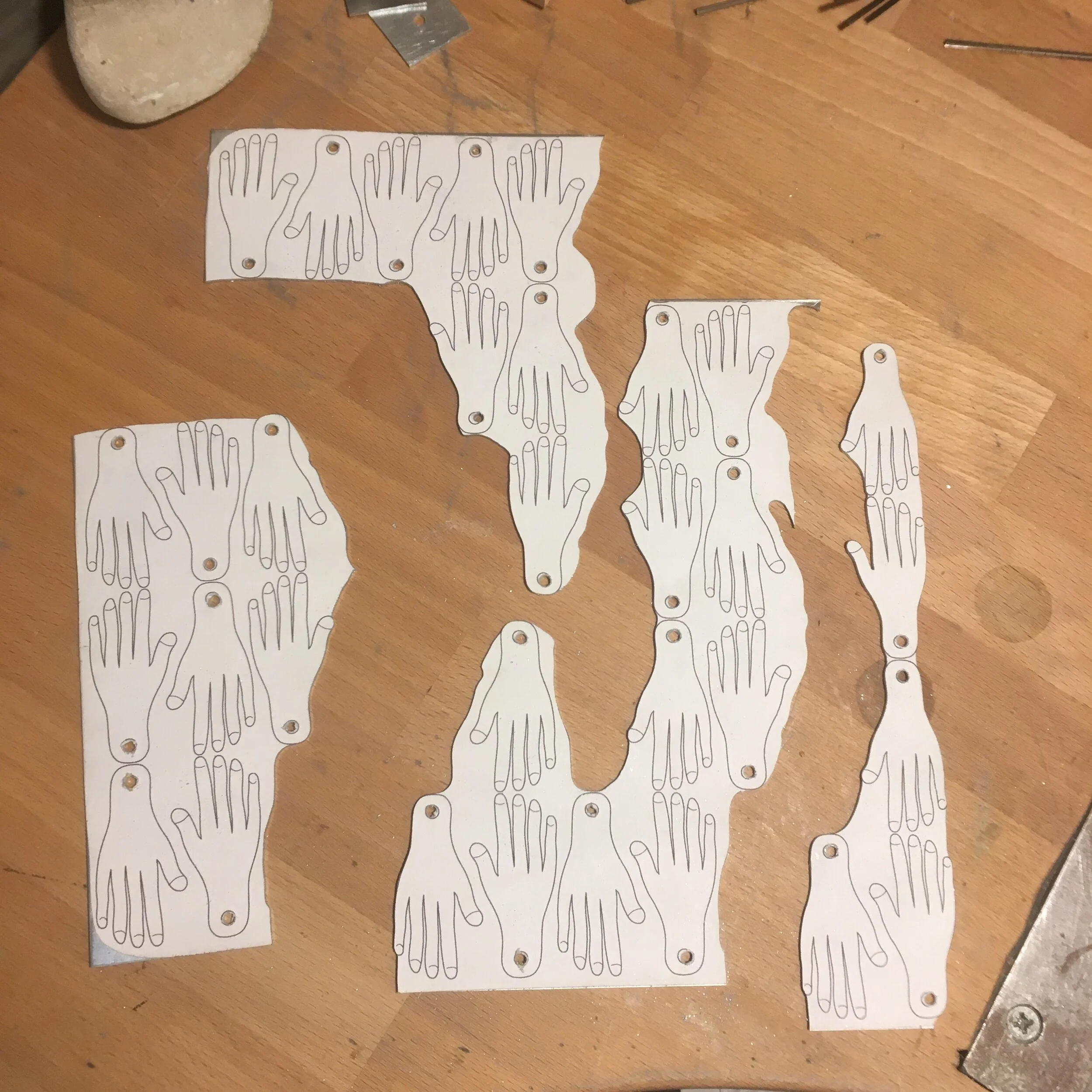 Made wholes for the ribbons and started sawing.