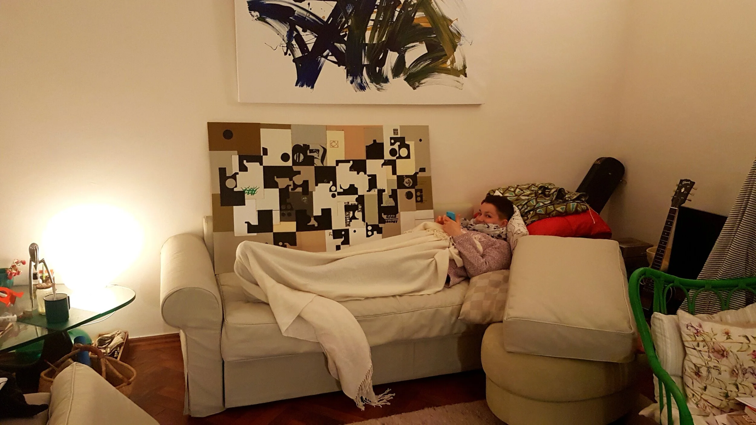 Book cover 'painting' above the couch - the 'artist' is resting underneath ;) 