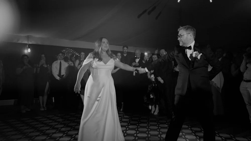 A moment from Jennifer and Rikki's wedding film