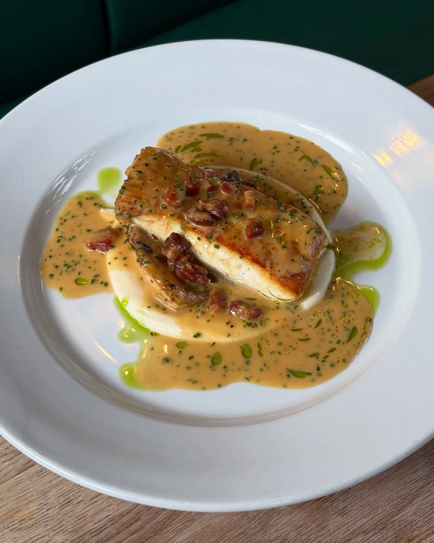 Pan fried halibut, roasted celeriac, homecured pancetta &amp; chicken butter sauce.