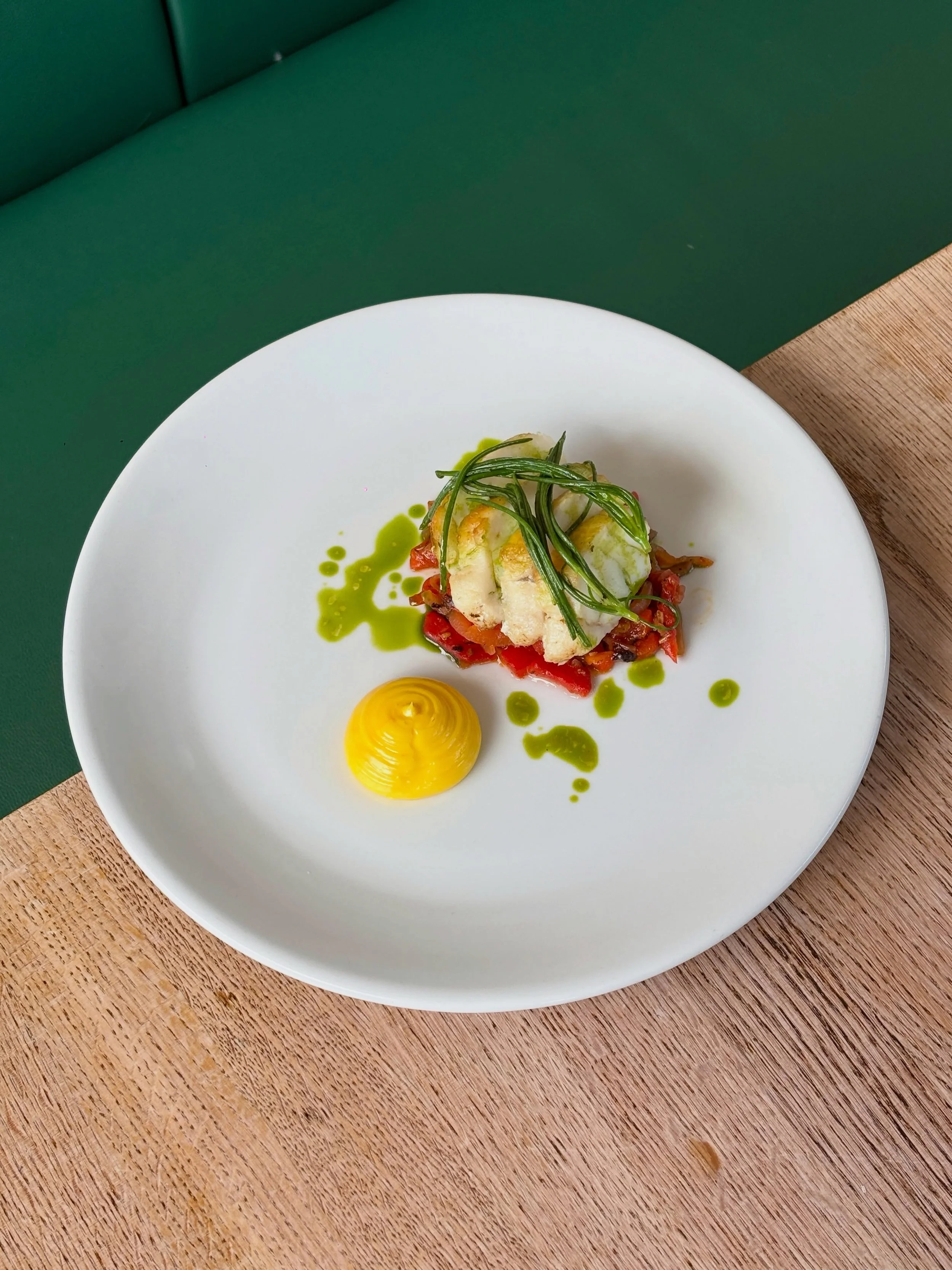 Fish from Brixham day boats with peperonata, agretti and saffron &amp; garlic aioli.