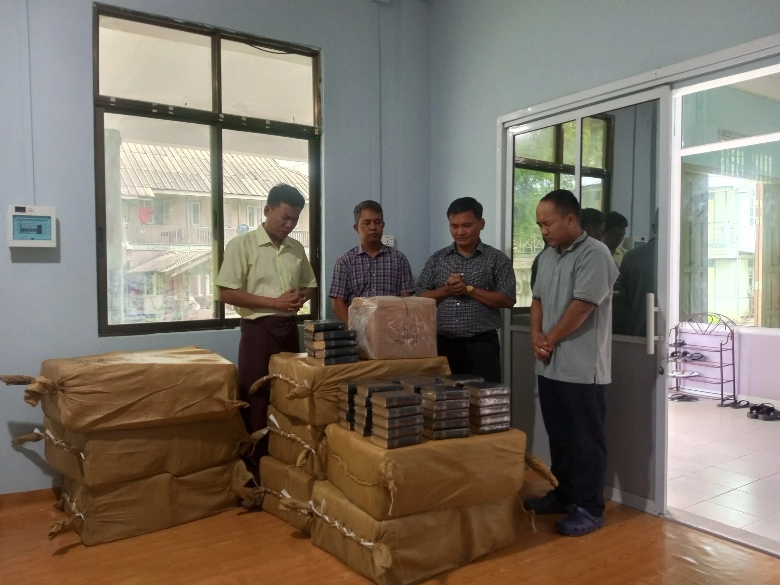 Myanmar - Bibles being received and prayed over before distribution