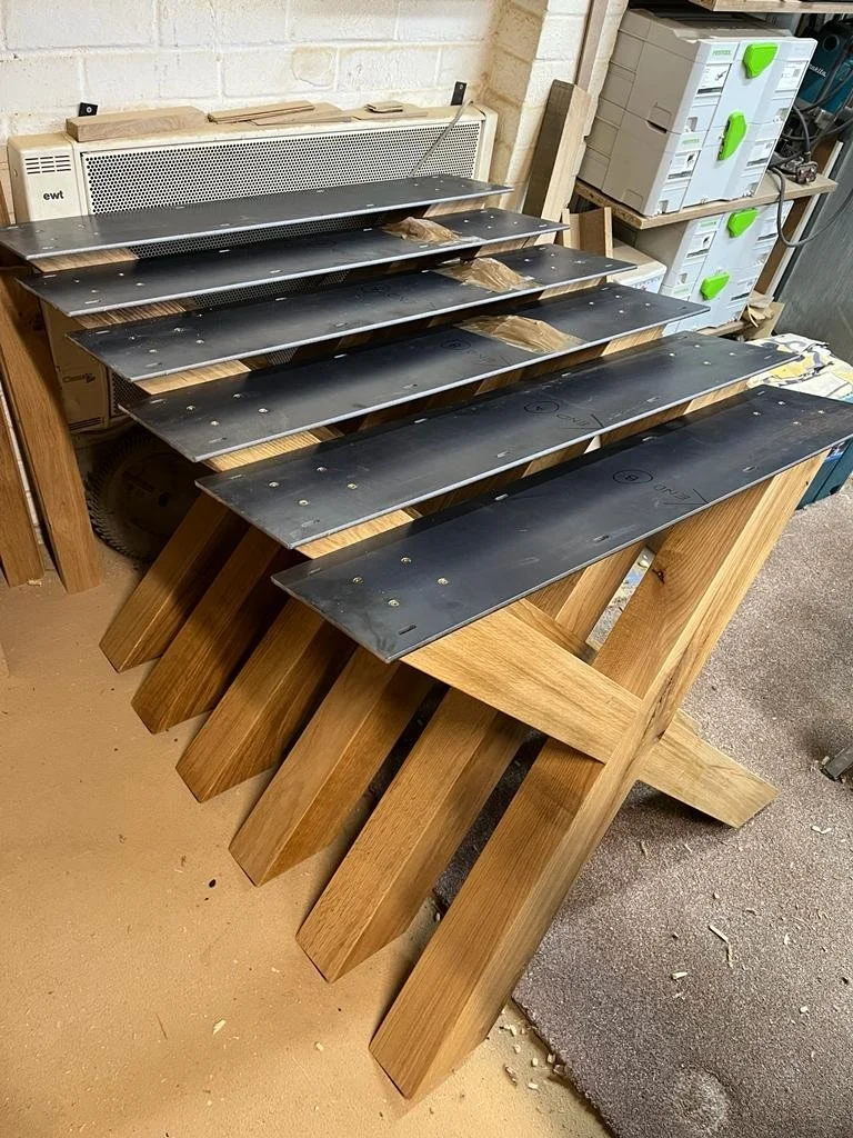 We use steel plates which allow for expansion to fix them to the tops