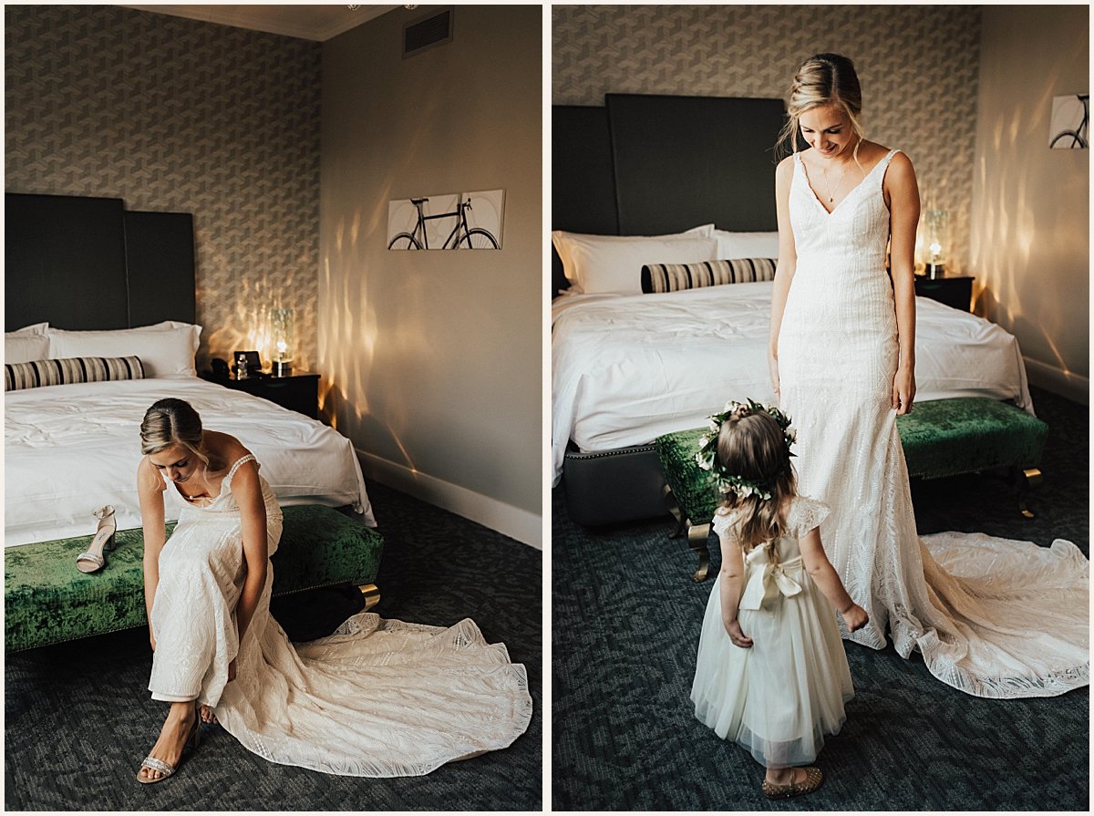 Bride putting on shoes with flower girl | Lauren Parr Photography