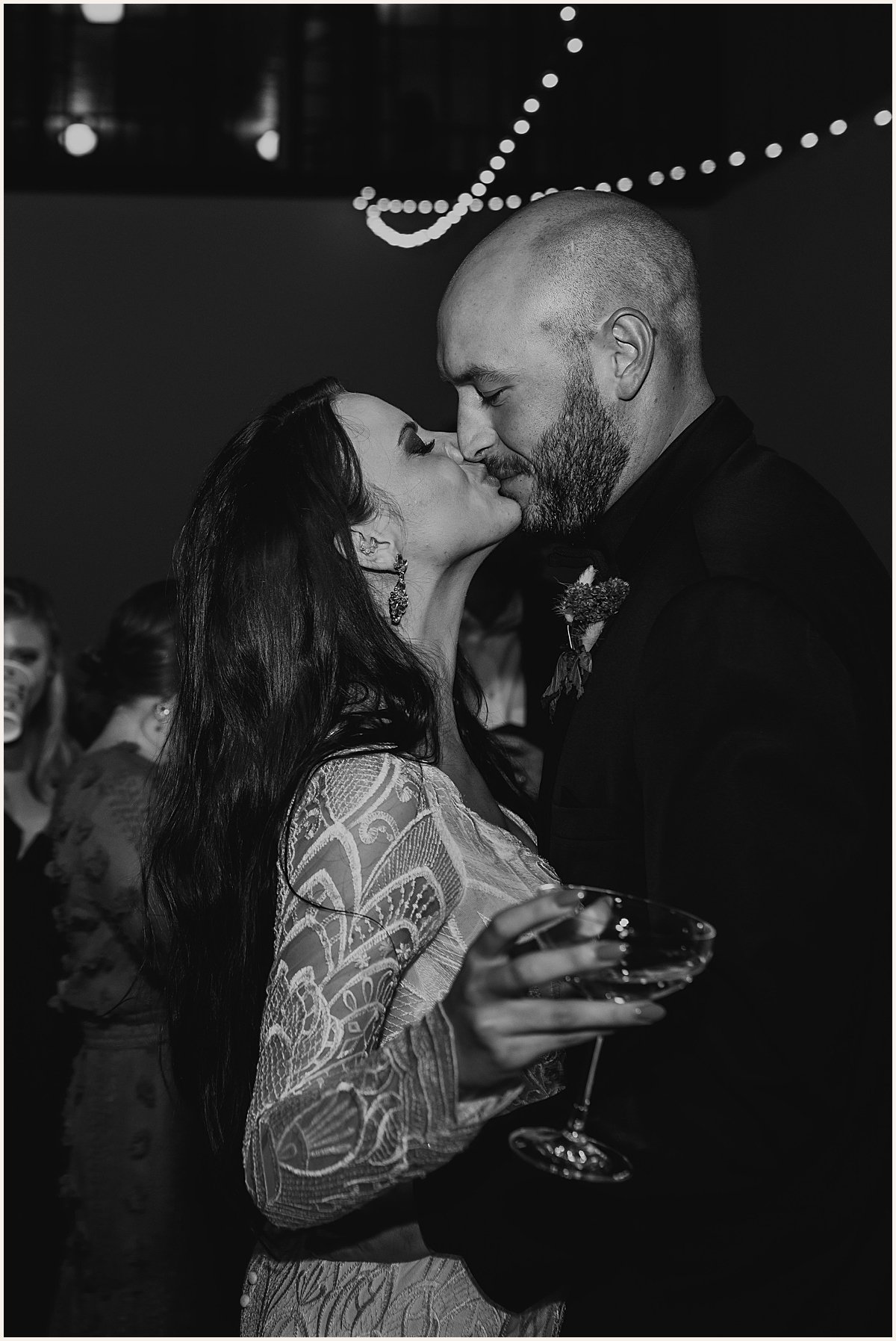 Bride and groom kissing on dance floor during wedding reception | Lauren Parr Photography