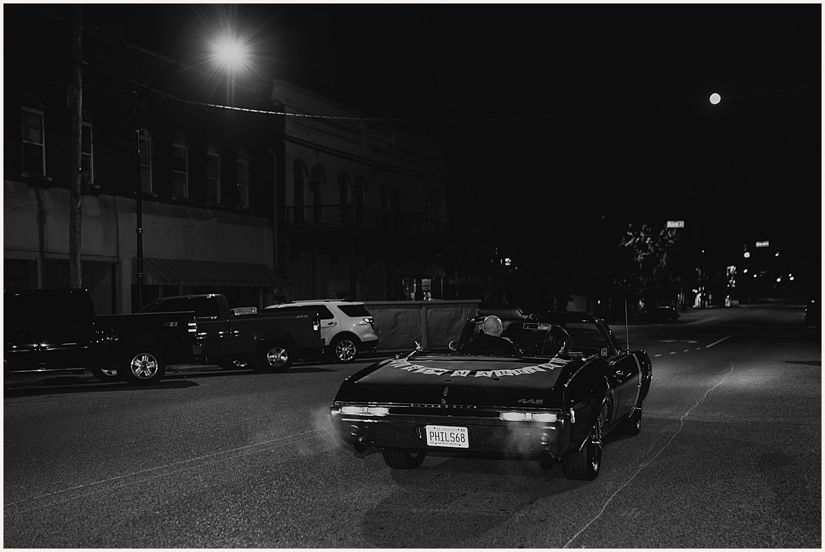 Bride and groom wedding exit in vintage car | Lauren Parr Photography