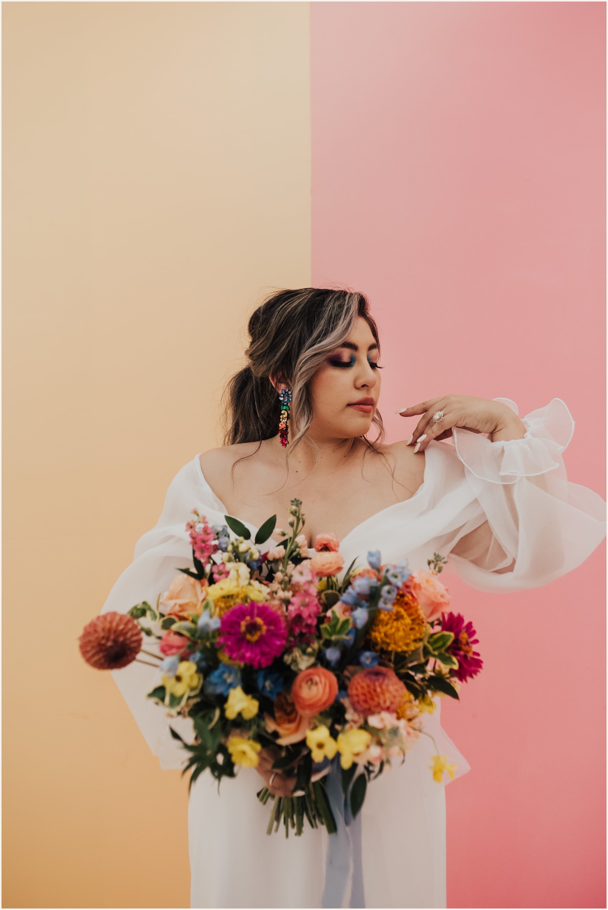 Bride in Puffy Sleeved Wedding Gown with Colorful Oversize Bouquet | Lauren Parr Photography | Austin Based Wedding Photographer