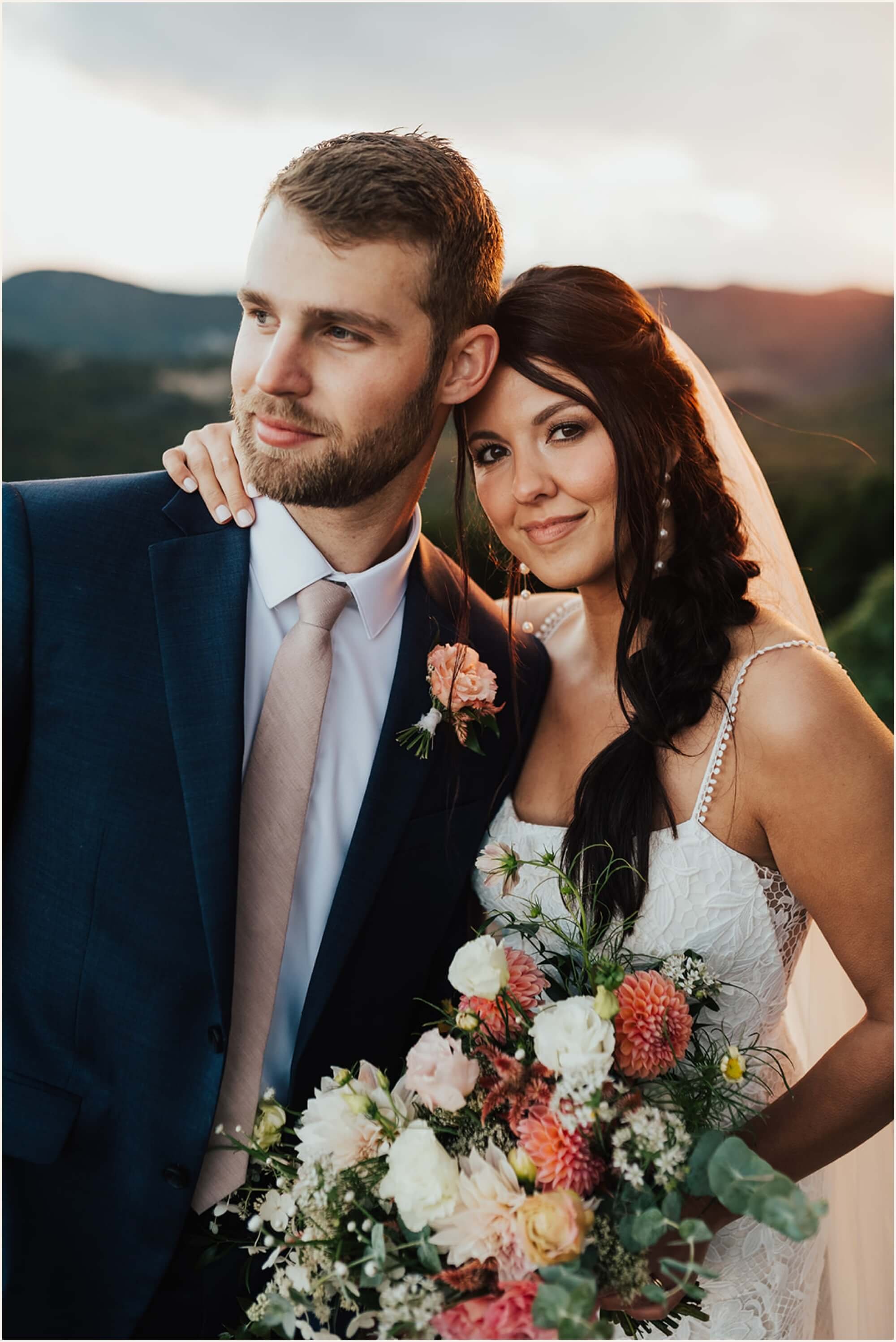 Bride and groom taking sunset photos in the Blue Ridge Mountains