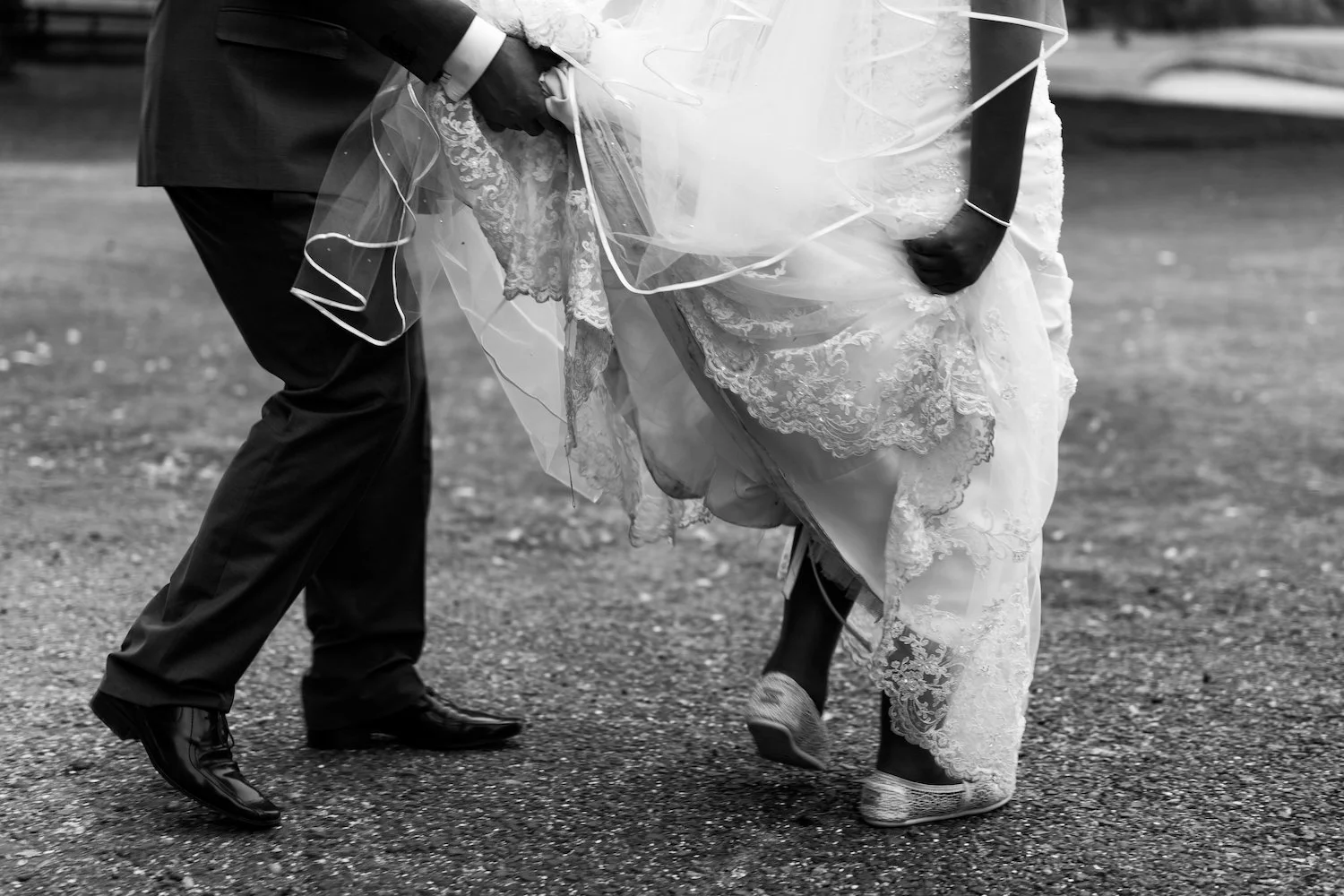 Holding-wedding-dress-trainers.jpg
