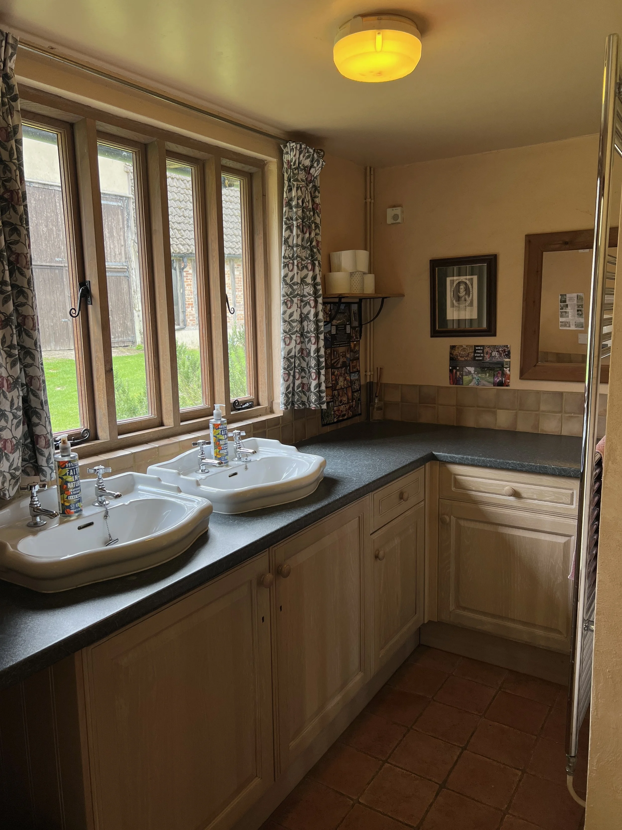 Loo & shower block across the grass lawn. 4 showers & 5 loos