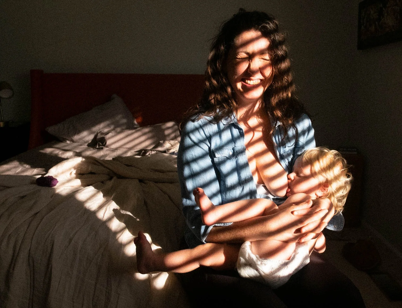 mom-in-golden-window-light-nursing-baby.jpg