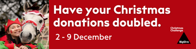 Red banner with white text promoting Christmas donations doubling from December 2-9, featuring a child with a toy horse wearing a Christmas hat