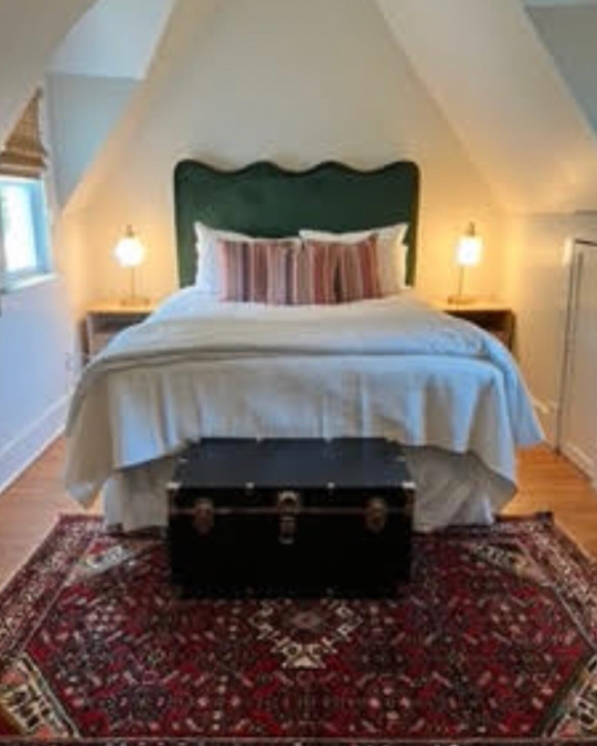 We love this transformation! This upstairs bedroom in downtown Southern Pines was tricky with peaked ceilings and all the nooks and crannies that come with older homes. We helped transition it from a child&rsquo;s bedroom into a guest room with new f