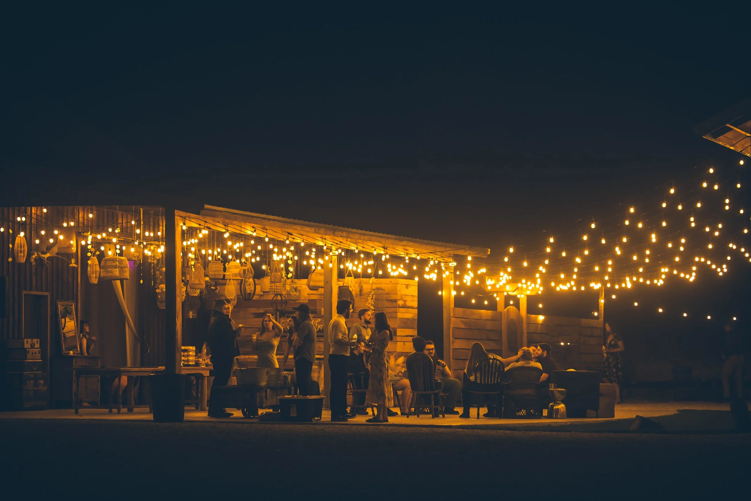 in the night with many string lights wedding 