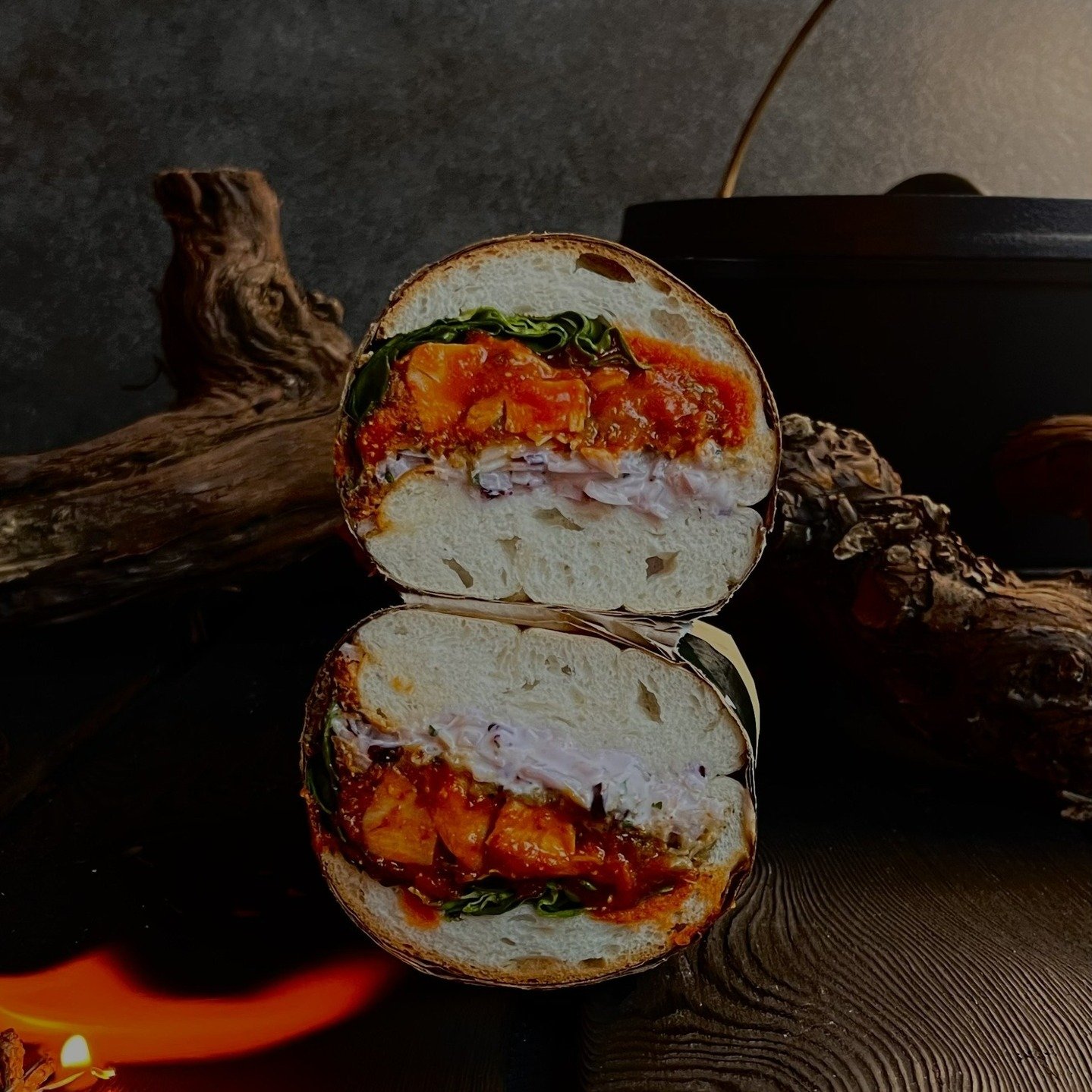 our spicy chicken sandwich. @feighcullenfarm roasted chicken, barrel-aged hot sauce gravy, crispy chicken skin stuffing, seasonal slaw, seasons greens. on @oaksmokebakery ciabatta.
