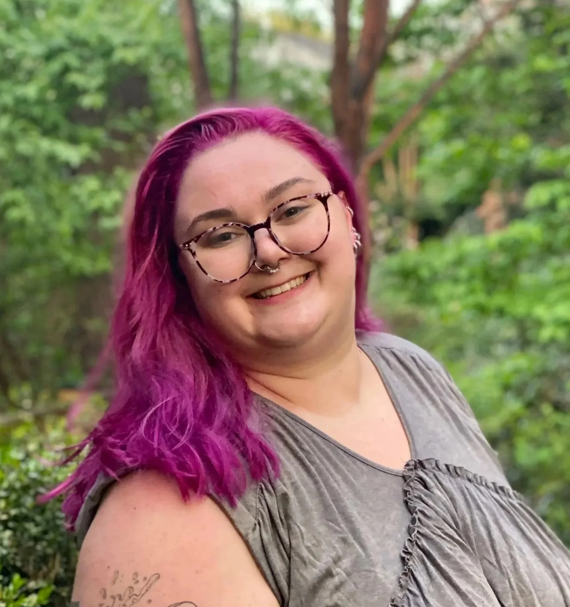 picture of LGBTQ Couples therapist in dc, outdoors with pink hair