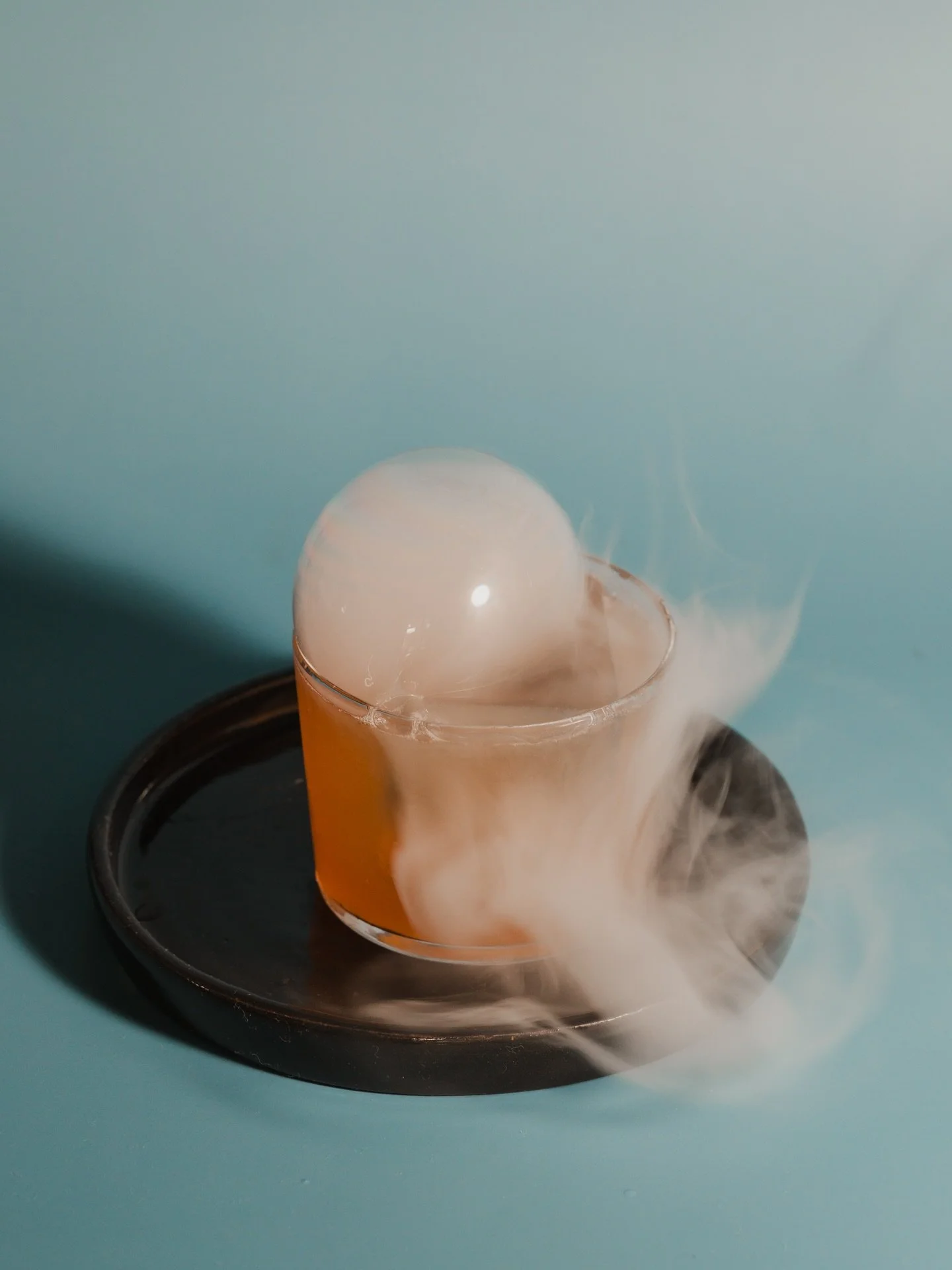 Smoke is Rising - Ethiopian Flash Brew, Lapsang Simple Syrup, Orange, Angostura Bitters, Clarified Through Whole Milk,  served ice cold with a cloud of smoke
*To be enjoyed in-house only