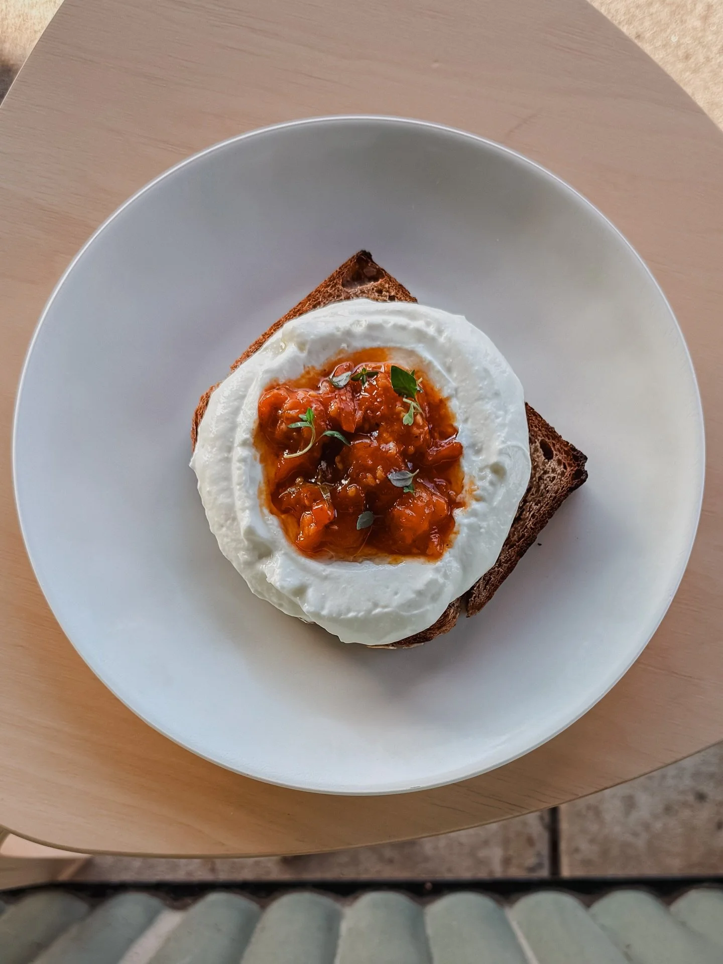 Tomato Tartine nestled in a pocket of ricotta! This is a killer bite and a perfect savory treat!