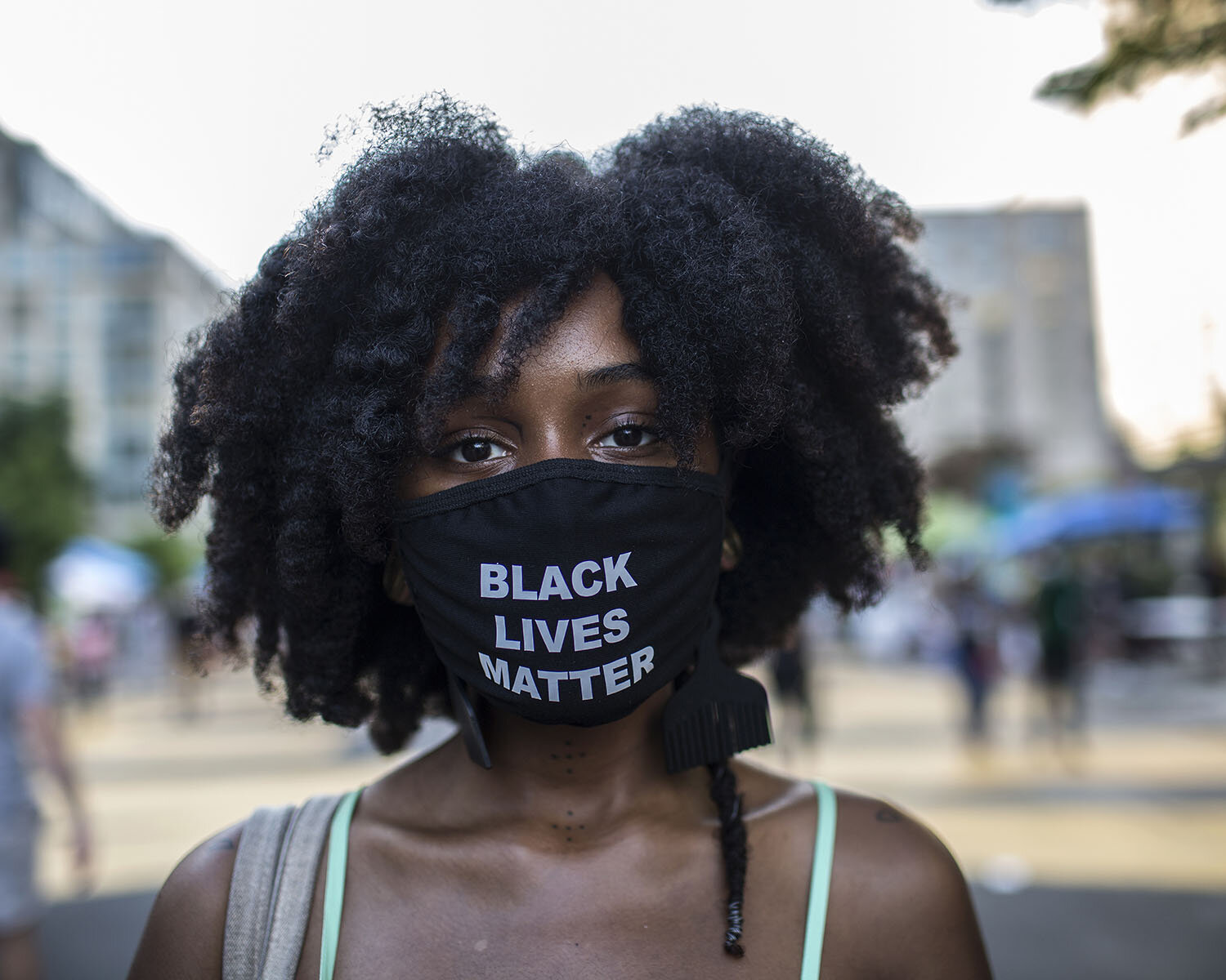  Name:  Tiaret Mitchell   Occupation: Tattoo artist  Date and Place the photo was taken: June 19, 2020, Black Lives Matter Plaza, Washington DC, U.S.A.  Her Statement:  “I’m glad to be apart of this current revolutionary state. It’s time for the tabl