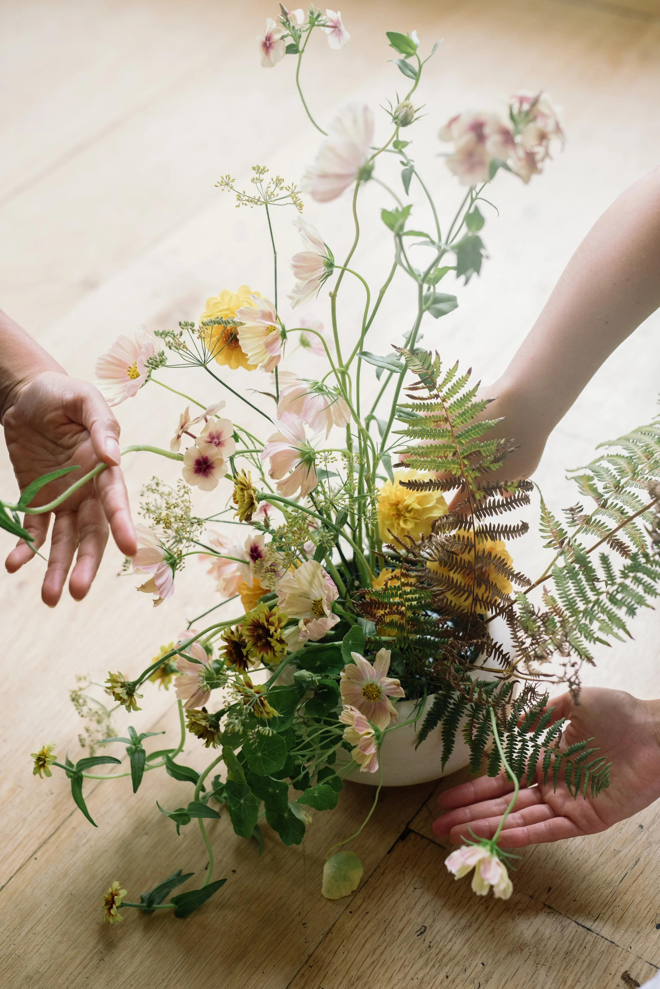 Yellow summer flowers in a simple bowl for a dance workshop