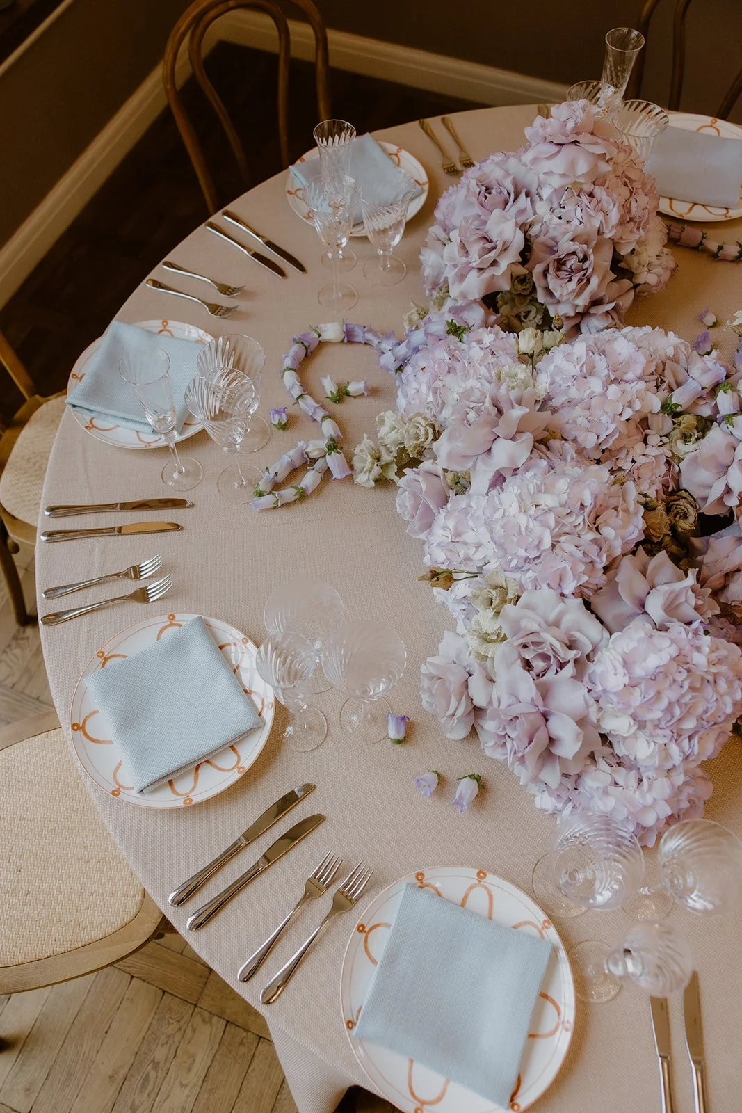 Lilac table flowers, open reflexed Roses, threaded Campanula. Limekiln, Sussex.
