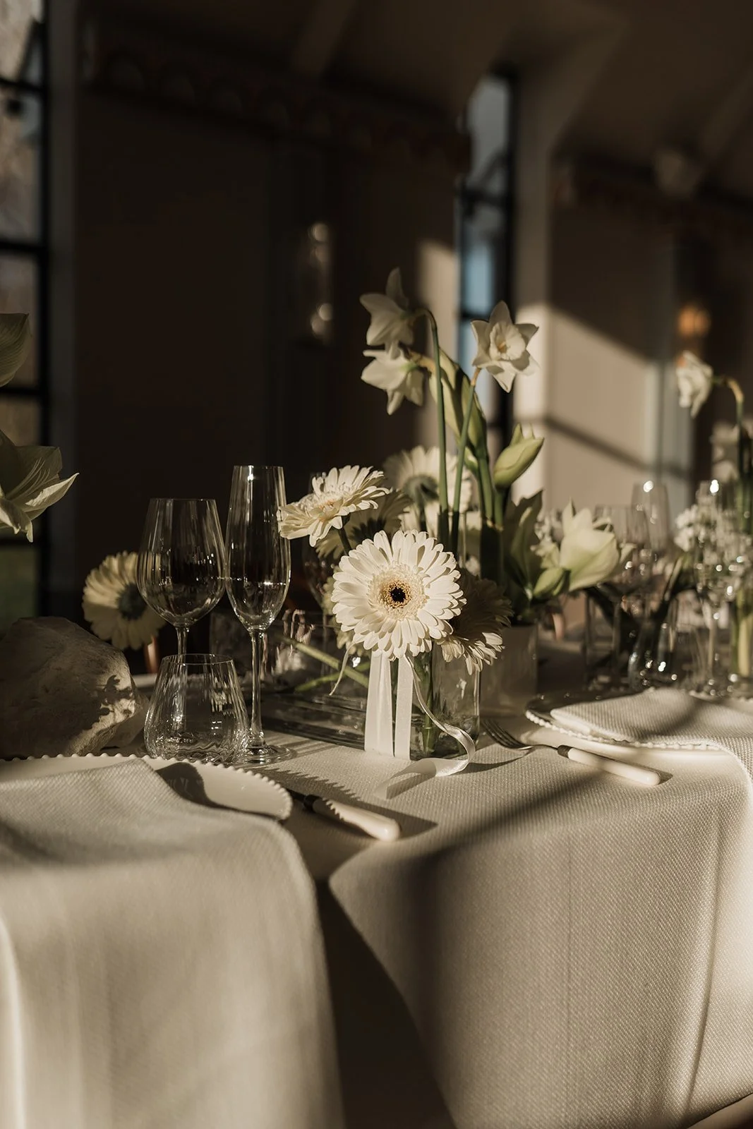 Spring tablescape caught in the sunlight at Limekiln, Sussex. Sister venue of Kin House, Wiltshire.