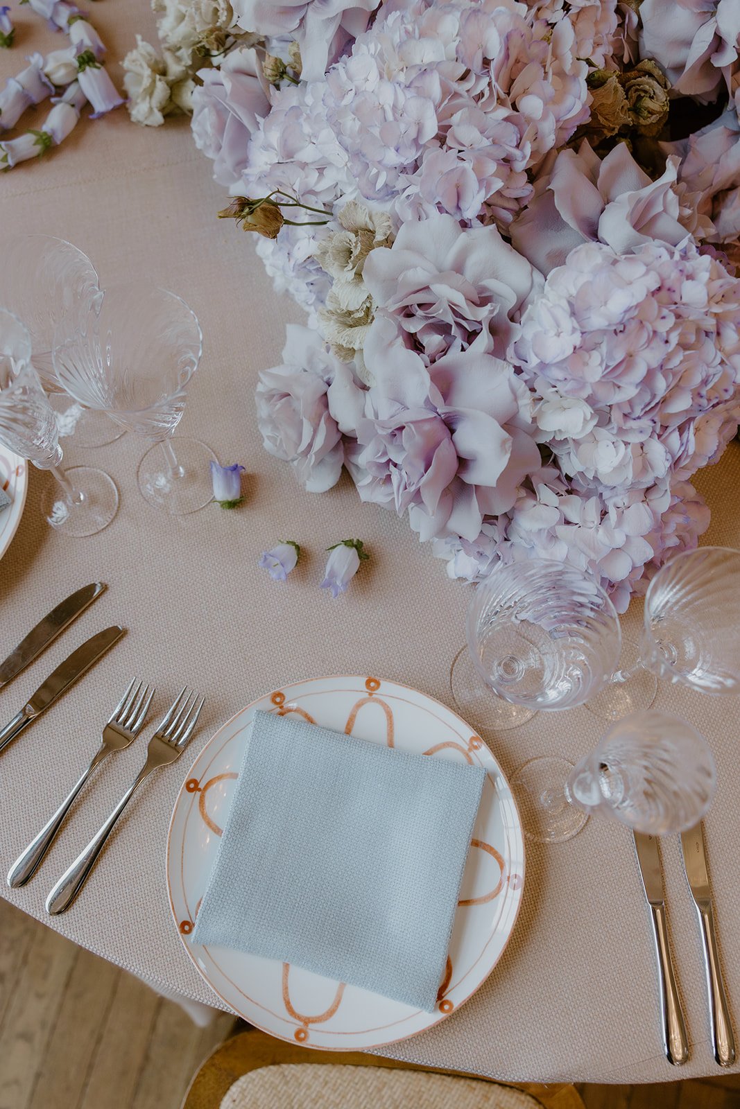 Lilac table flowers, open reflexed Roses, threaded Campanula. Limekiln, Sussex.