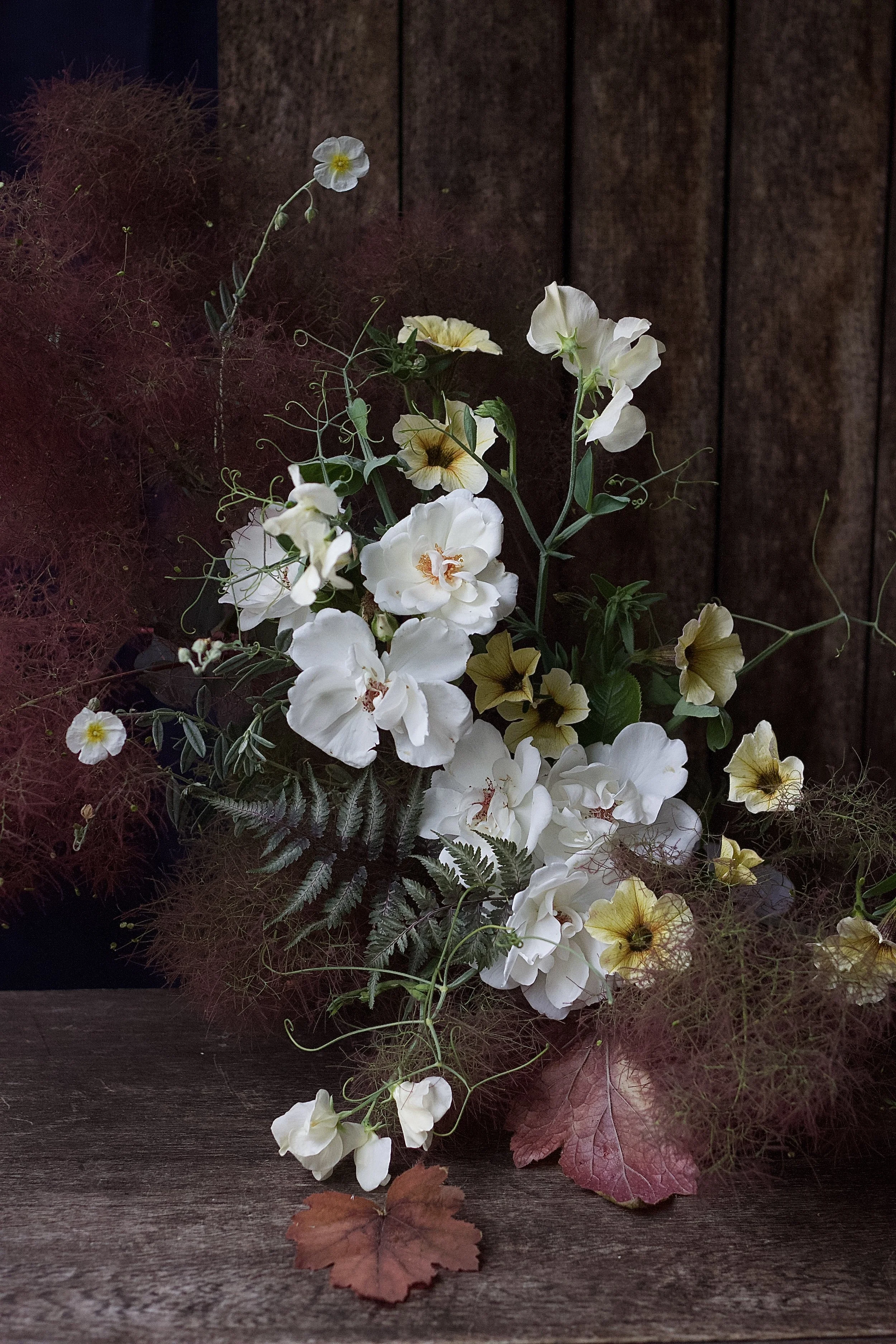 Midsummer garden gathered design with Roses and Petunia for an event London