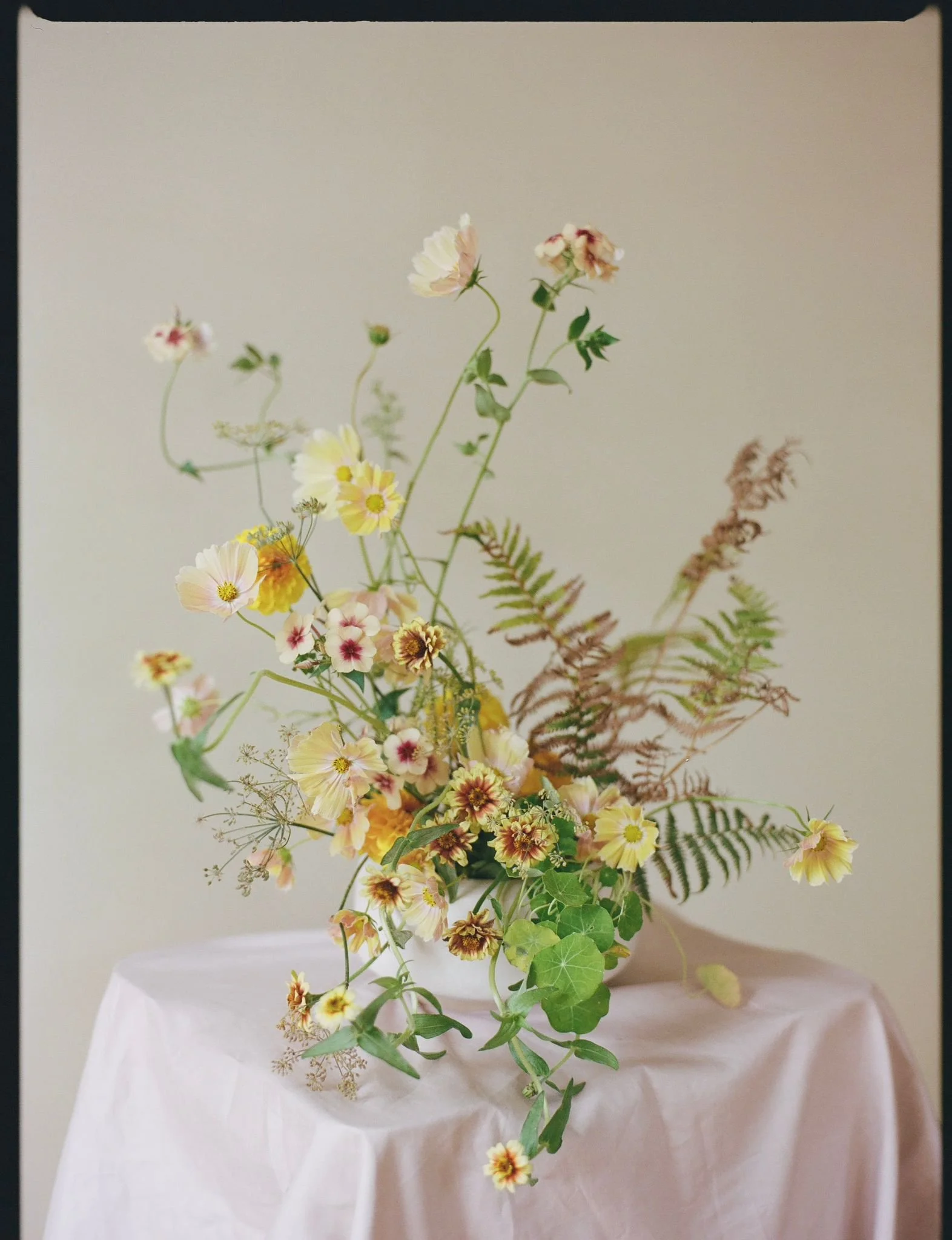 Yellow summer flowers in a simple bowl for a dance workshop