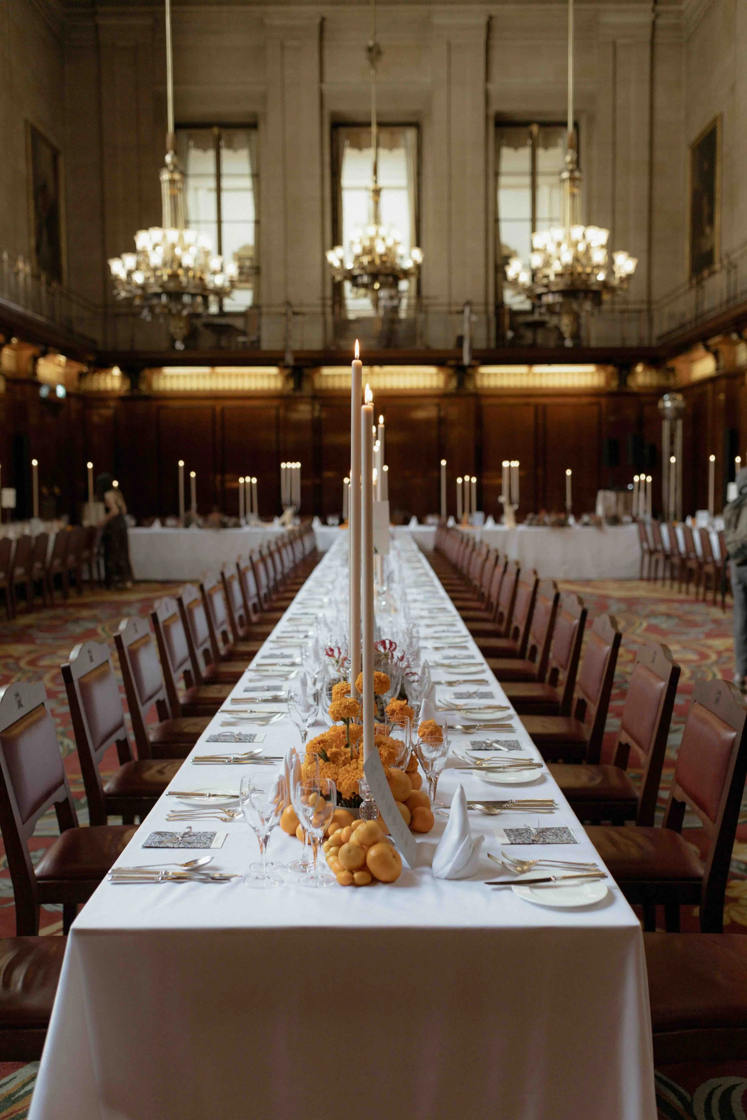 Metre candles oranges kumquats and marigolds fro vibrant summer wedding in central London