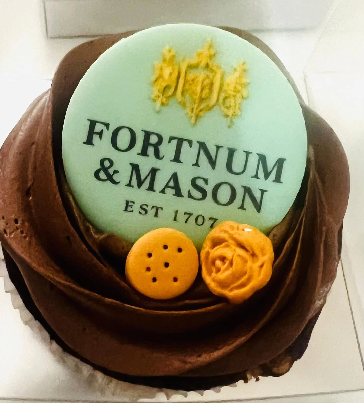 Corporate cupcake featuring a Fortnum &amp; Mason-inspired edible coin.