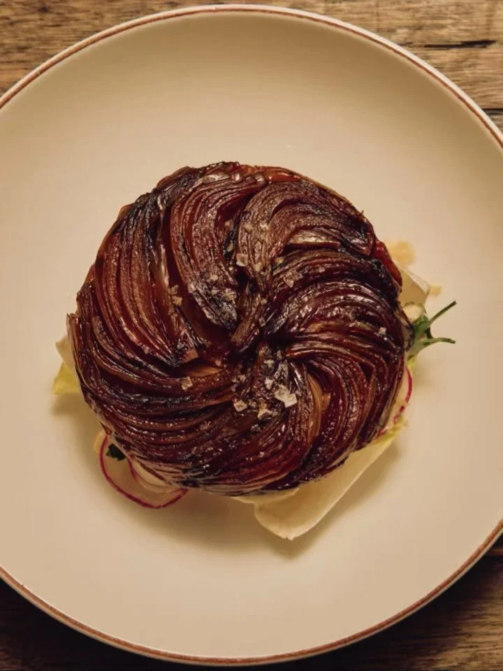 🧅 ONION TARTE TATIN ✨ Cooked low &amp; slow&hellip; caramelised jammy onions on flaky butterrrry pastry. Served on a bed of crisp mizuna &amp; radish, with just a touch of blue cheese &amp; balsamic.

Sweet, savory, creamy, and sharp: it makes a per